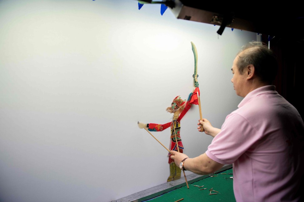 Beijing Shadow Show Troupe puppet master Lu Baobang. Photo: AFP