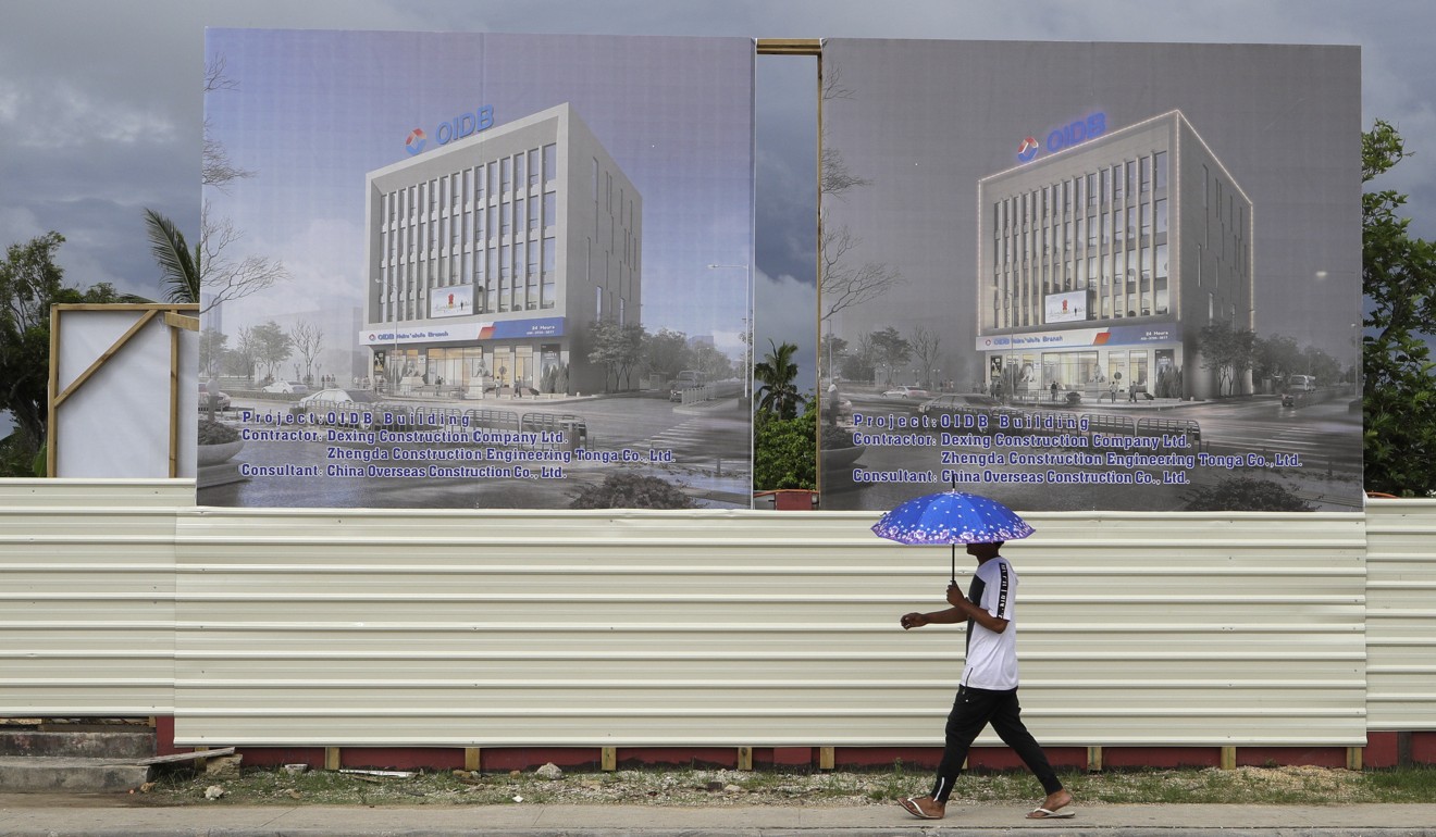 Tongan government officials work in an office block that was an US$11 million gift from China. Photo: AP