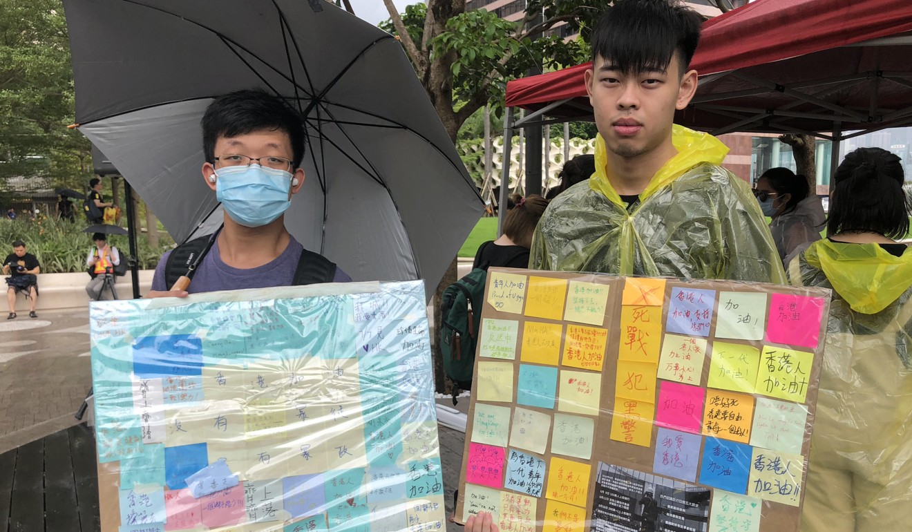 Students Isaac Pang (left) and Samuel Chu have managed the Lennon Walls in Wong Tai Sin and Tai Po respectively. Photo: Jeffie Lam