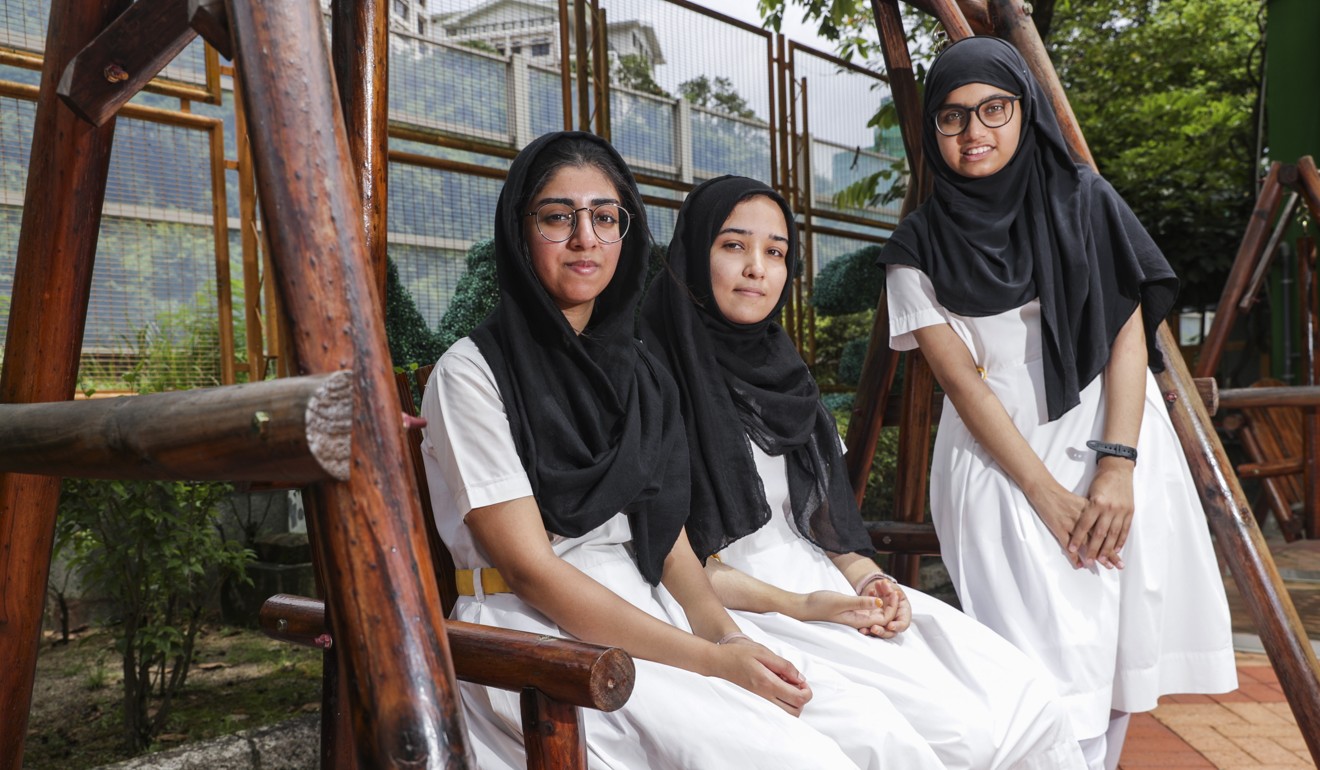 (Left to right) Bisma Naz, Alina and Rani Maryam received their Diploma of Secondary Education exam results on Wednesday. Photo: Edmond So