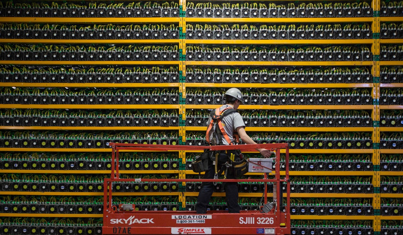 A technician inspects the backside of bitcoin mining at Bitfarms in Quebec. US President Donald Trump has come out against cryptocurrencies. Photo: AFP