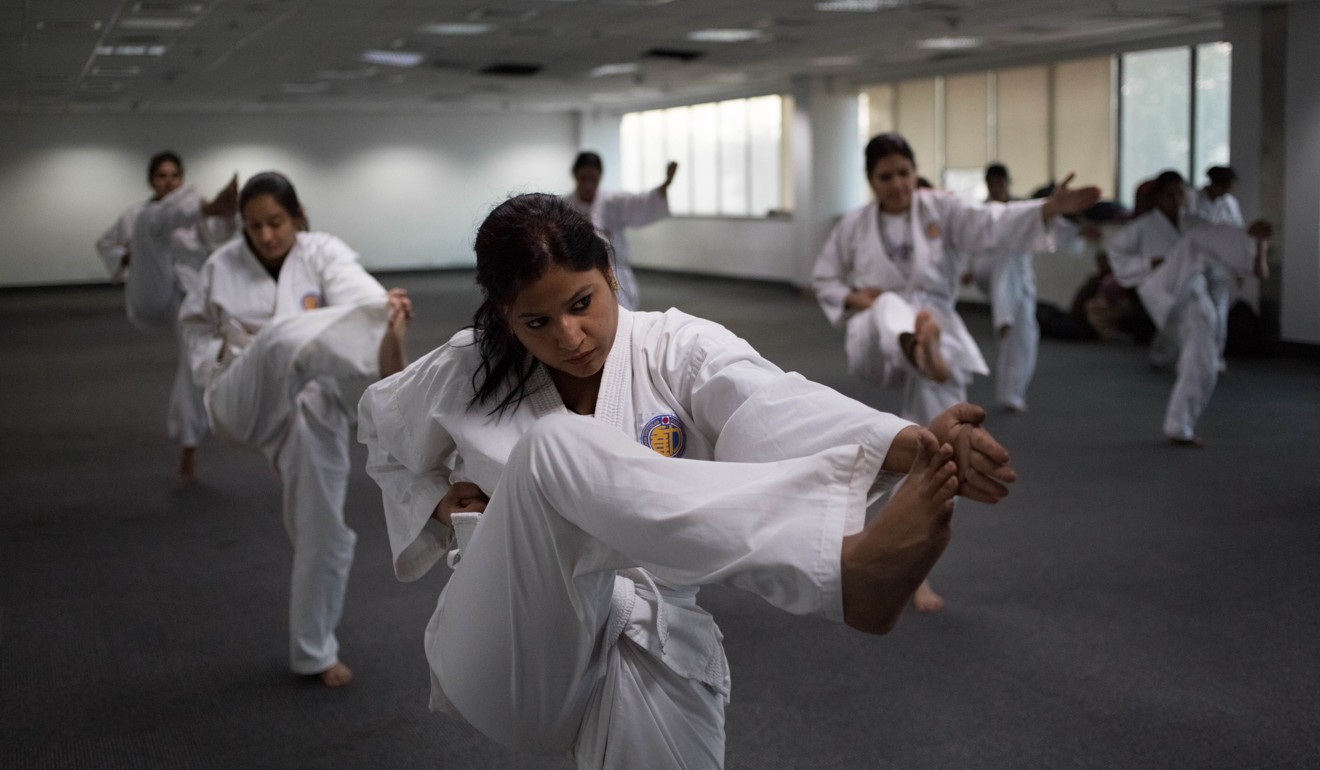 Exceptions to the rule: Indian policewomen practise kicks during a self-defence class in New Delhi. Photo: AFP