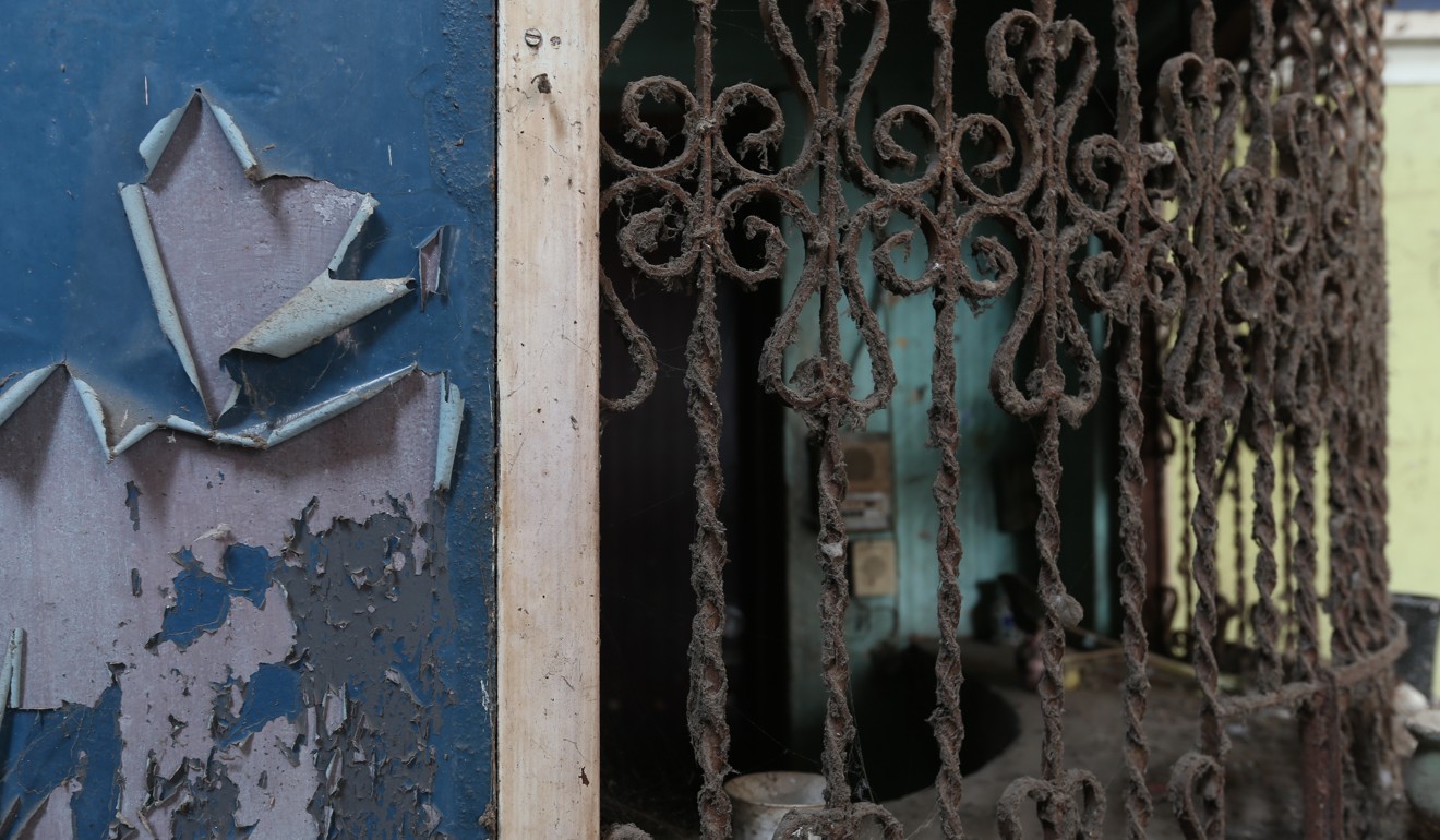 The locked and rusting ticket window of New Chalerm Uthai’s cinema. Photo: Philip Jablon