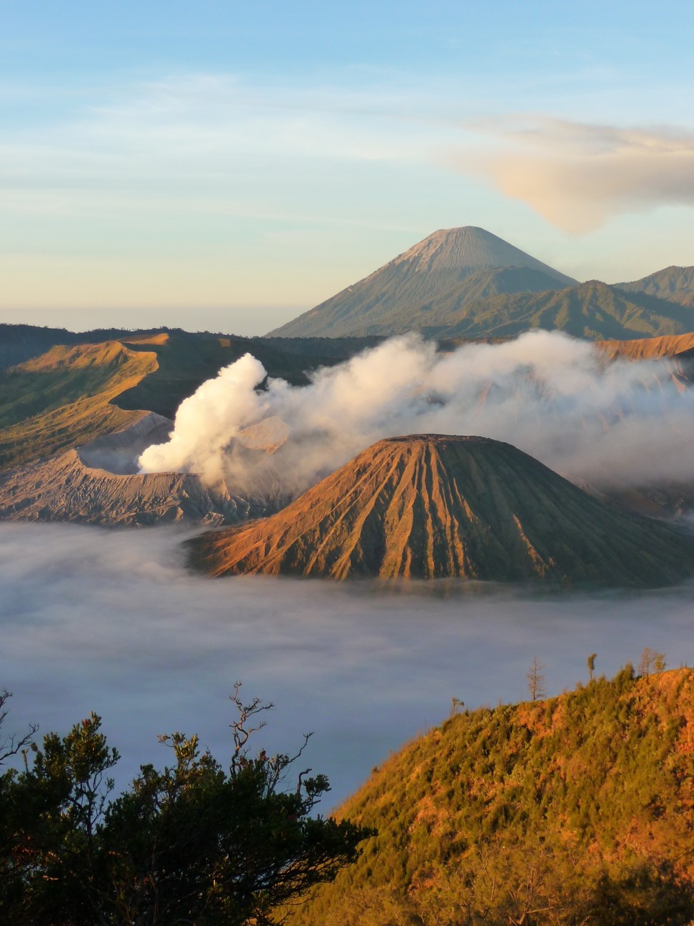 Mount Bromo (foreground) constantly billows out sulphurous, grey smoke and ash, but it hasn’t had a major eruption since 2015.