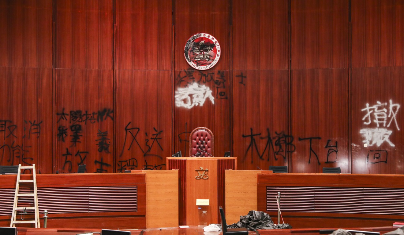 Graffiti on the wall of a trashed legislature in Hong Kong. Photo: Sam Tsang