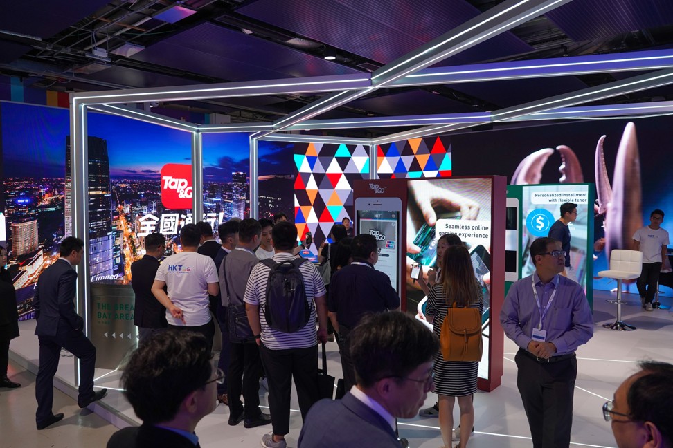 Attendees of the FinTech zone at HKT 5G Tech Carnival learning about the latest payment technology and how cash might soon become a thing of the past.