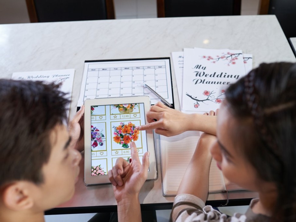 A wedding planner will help clients choose everything, such as the clothes they wear to the venue and catering. Photo: Dragon Images/Shutterstock