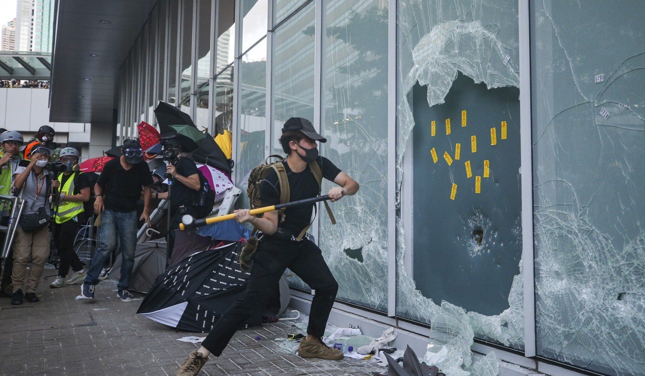 Protesters break windows in an attempt to storm Hong Kong’s legislature on July 1. Photo: Winson Wong