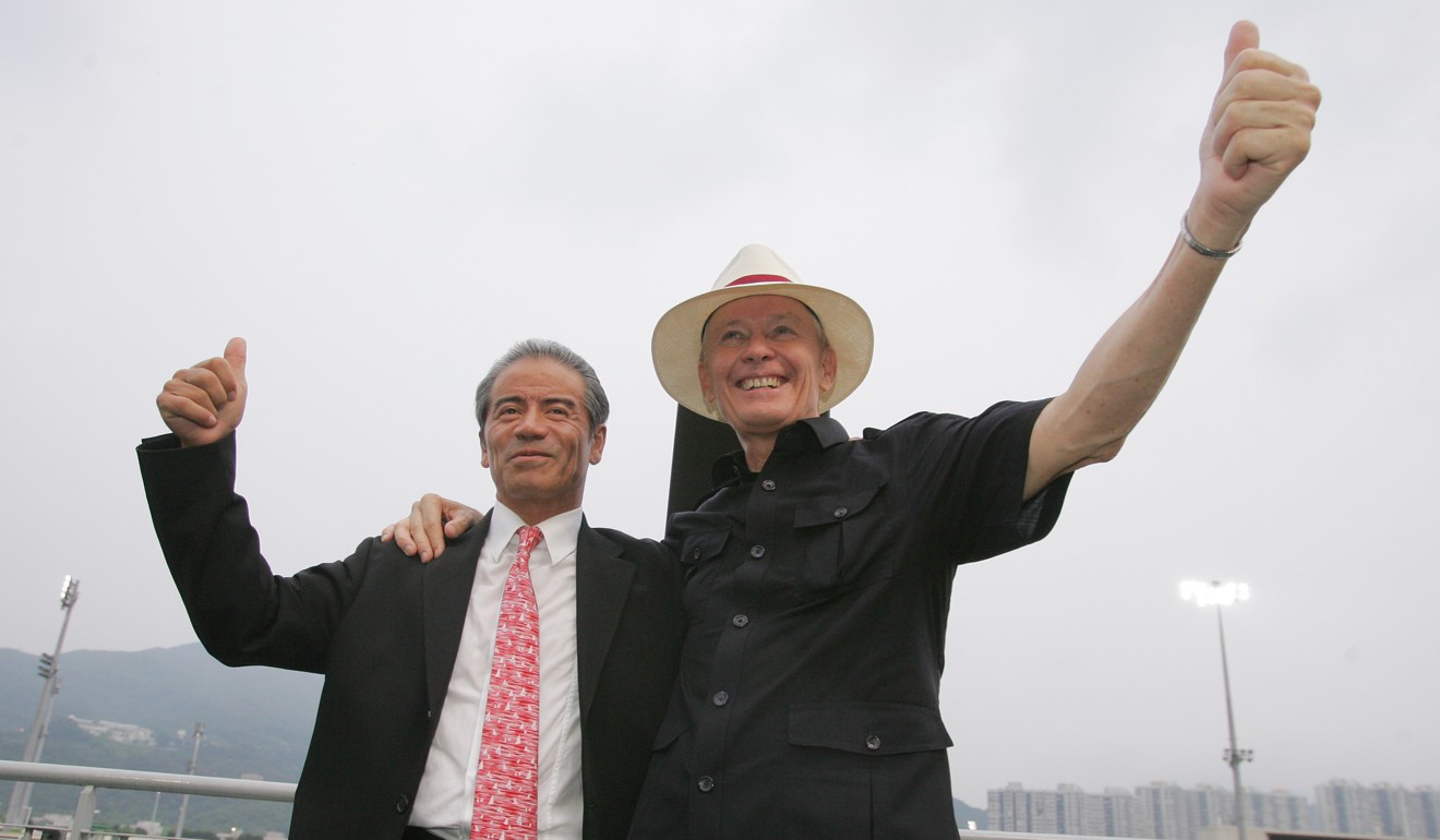 John Moore (right) Tony Cruz after coming from behind to win the premiership in 2011.