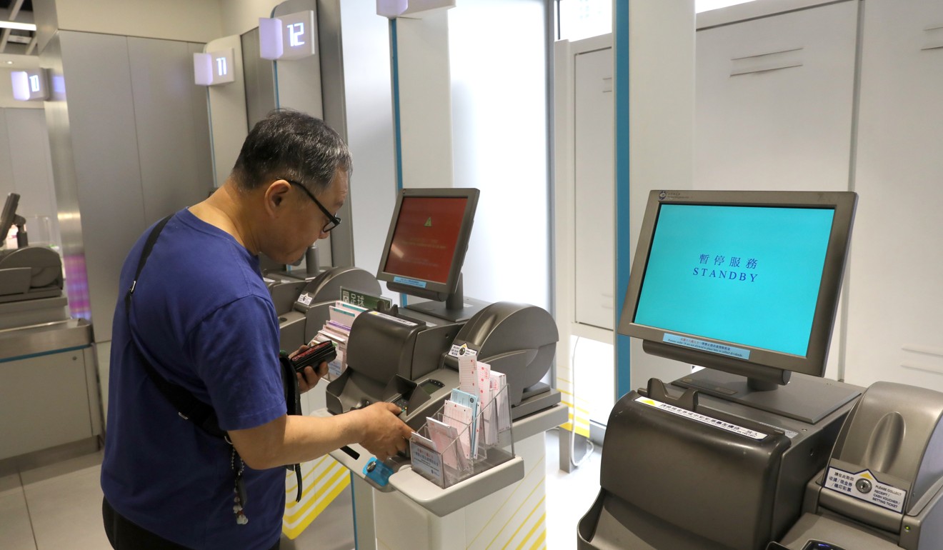 A gambler uses a betting machine at a Jockey Club branch. Photo: Sam Tsang