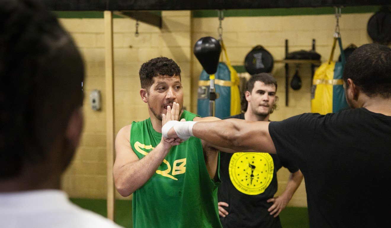 Boxing coach Trevor Sambrano takes a training session at the Jackrabbit Boxing Gym, East Long Beach. Photo: Jon Delouz