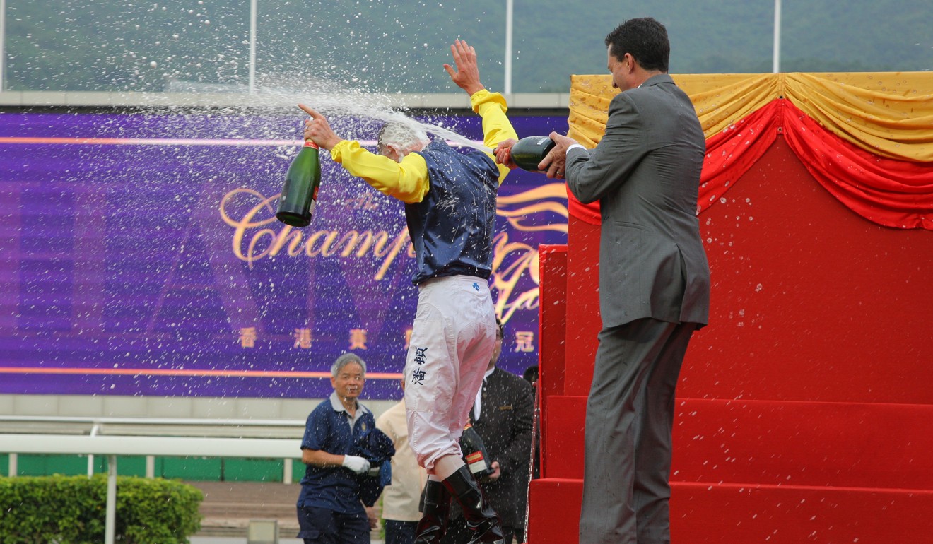 Douglas Whyte douses Zac Purton in champagne.