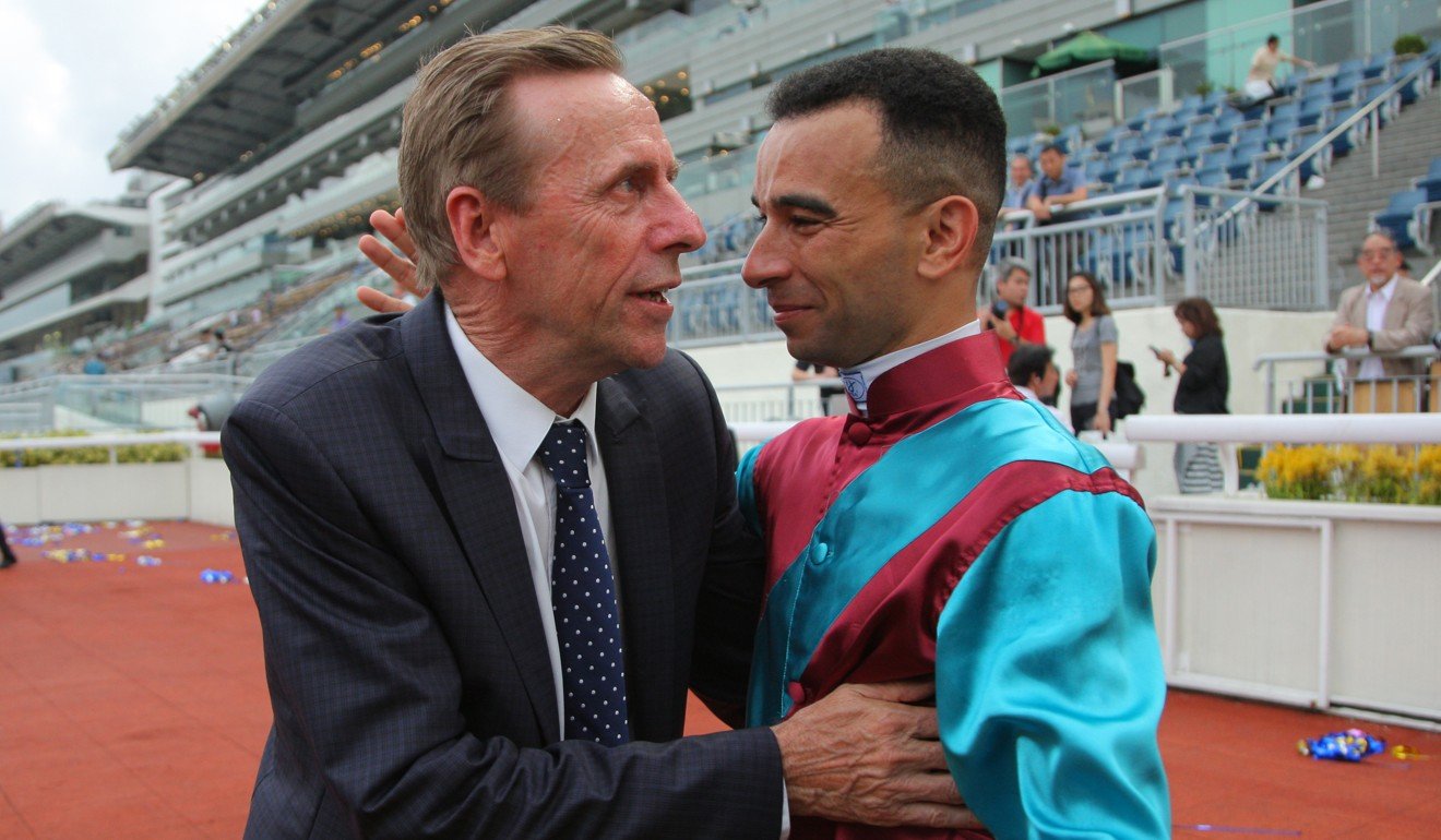 John Size is congratulated by jockey Joao Moreira after his title.