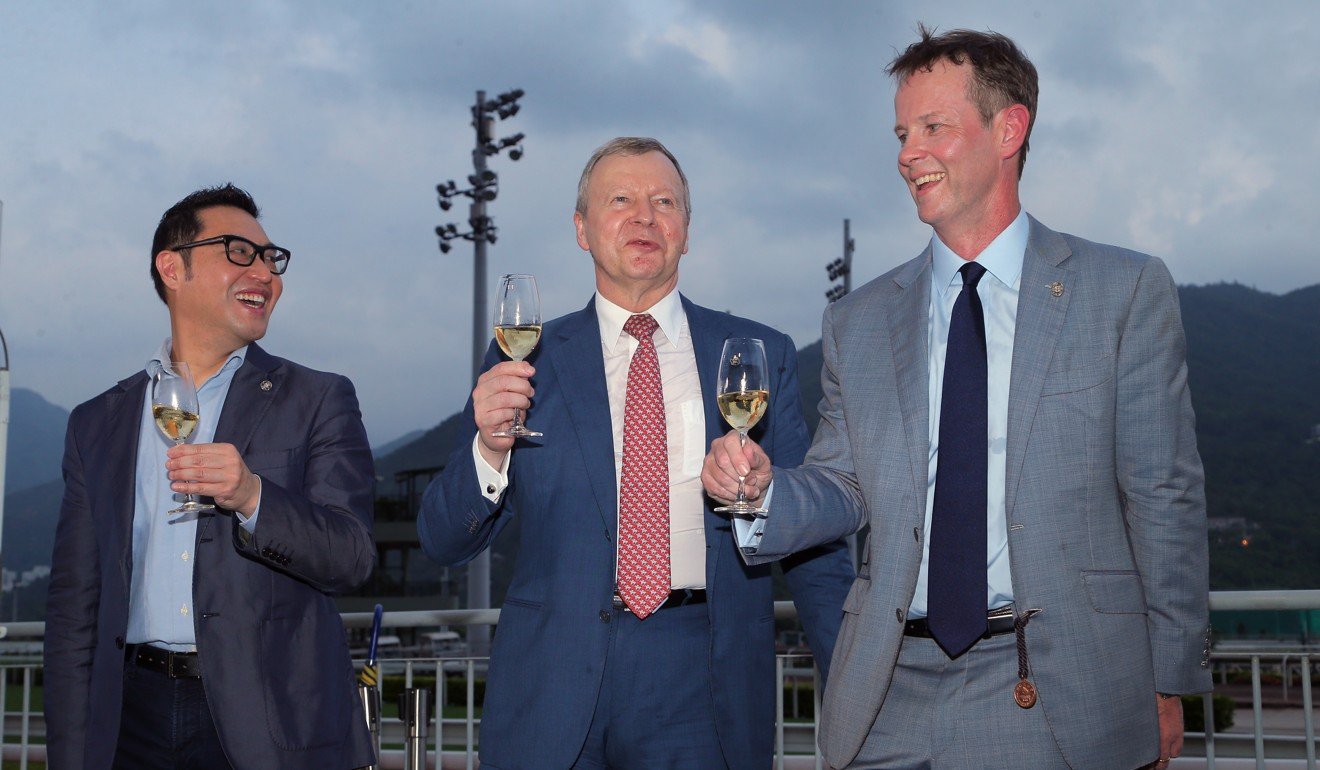 Jockey Club executive director of customer and marketing Richard Cheung, Jockey Club chief executive Winfried Engelbrecht-Bresges and Jockey Club executive director of racing Andrew Harding celebrate after the last race of the season.