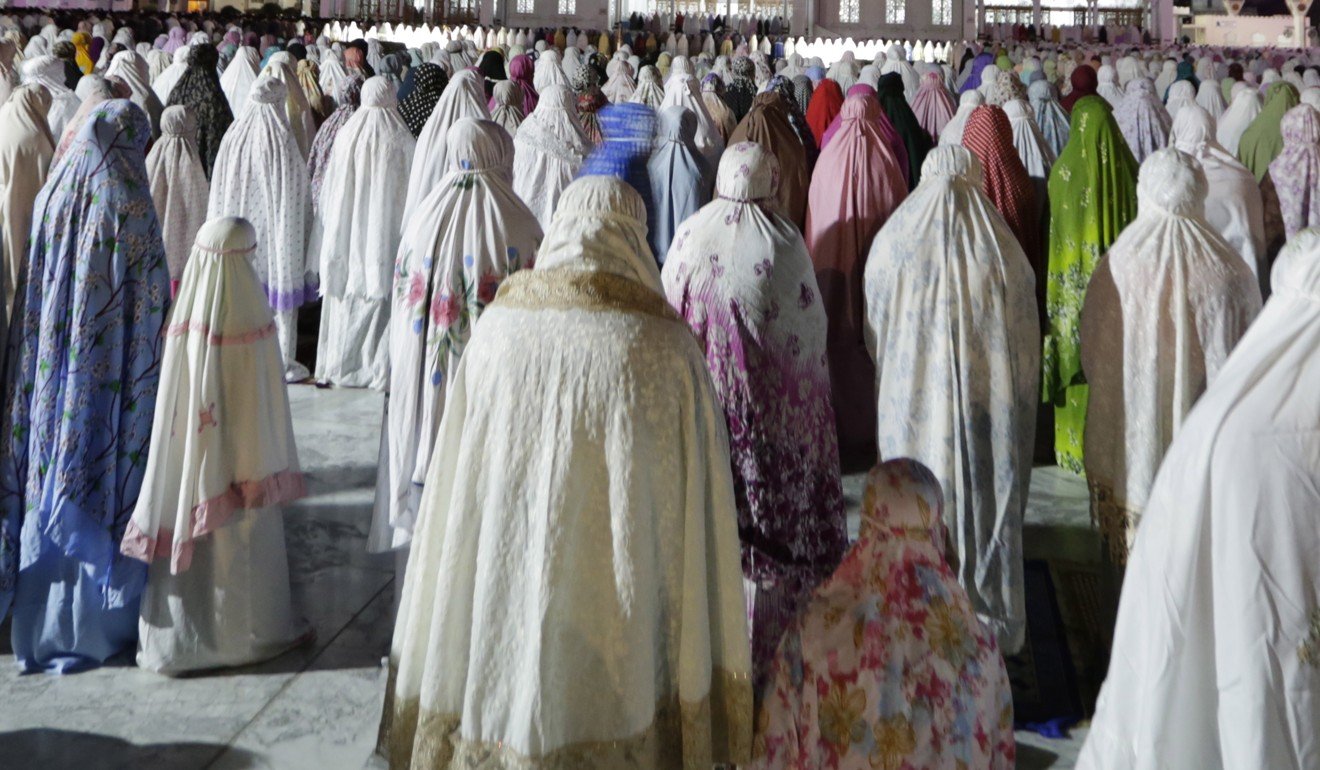 Indonesian Muslim women perform an evening prayer in Banda Aceh. File photo: EPA