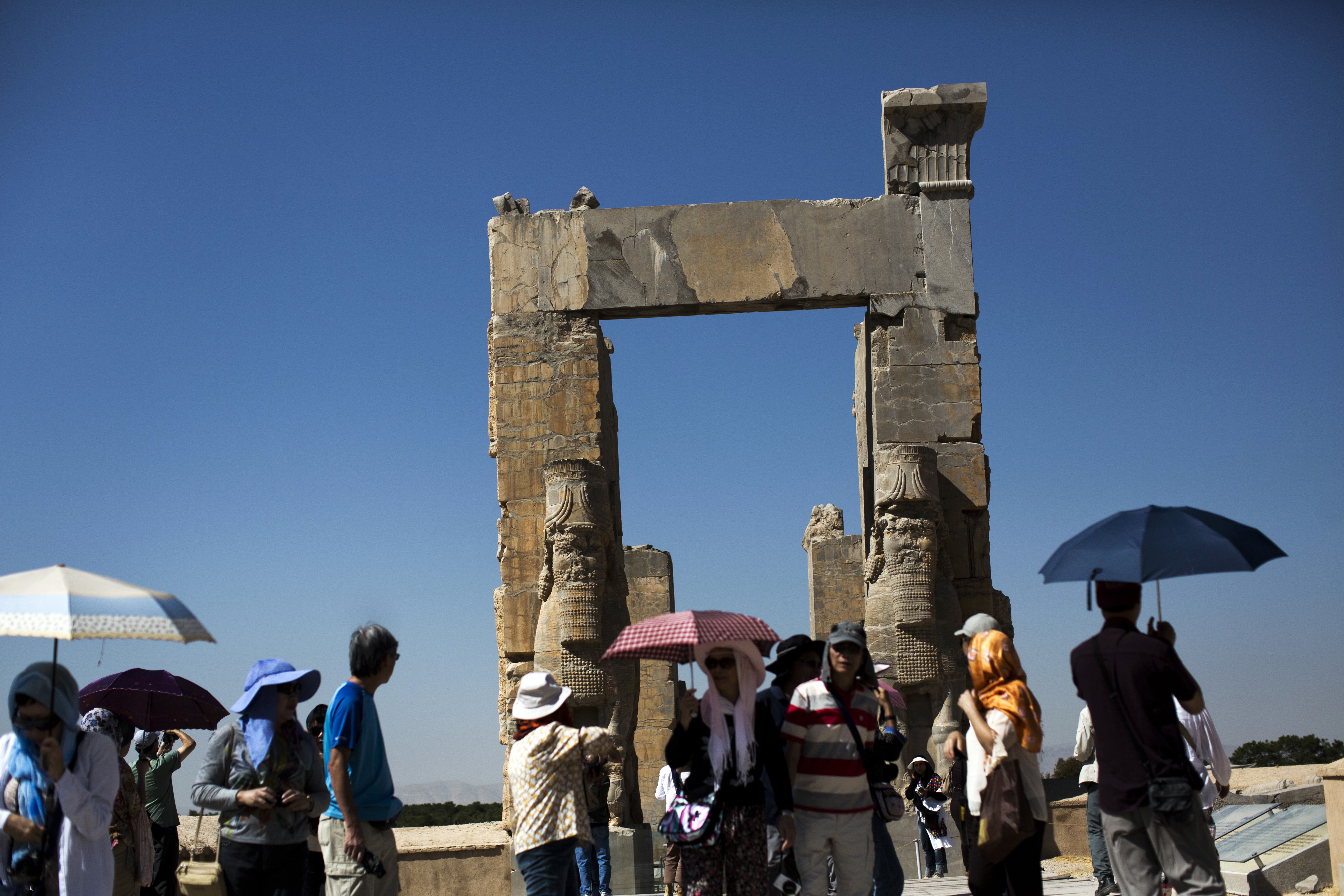 Chinese tourists visit the "Gate of All Nations" at the ancient Persian city of Persepolis near Shiraz in southern Iran, which is hoping to dramatically increase the number of visitors from China with a new visa waiver programme. Photo: AFP
