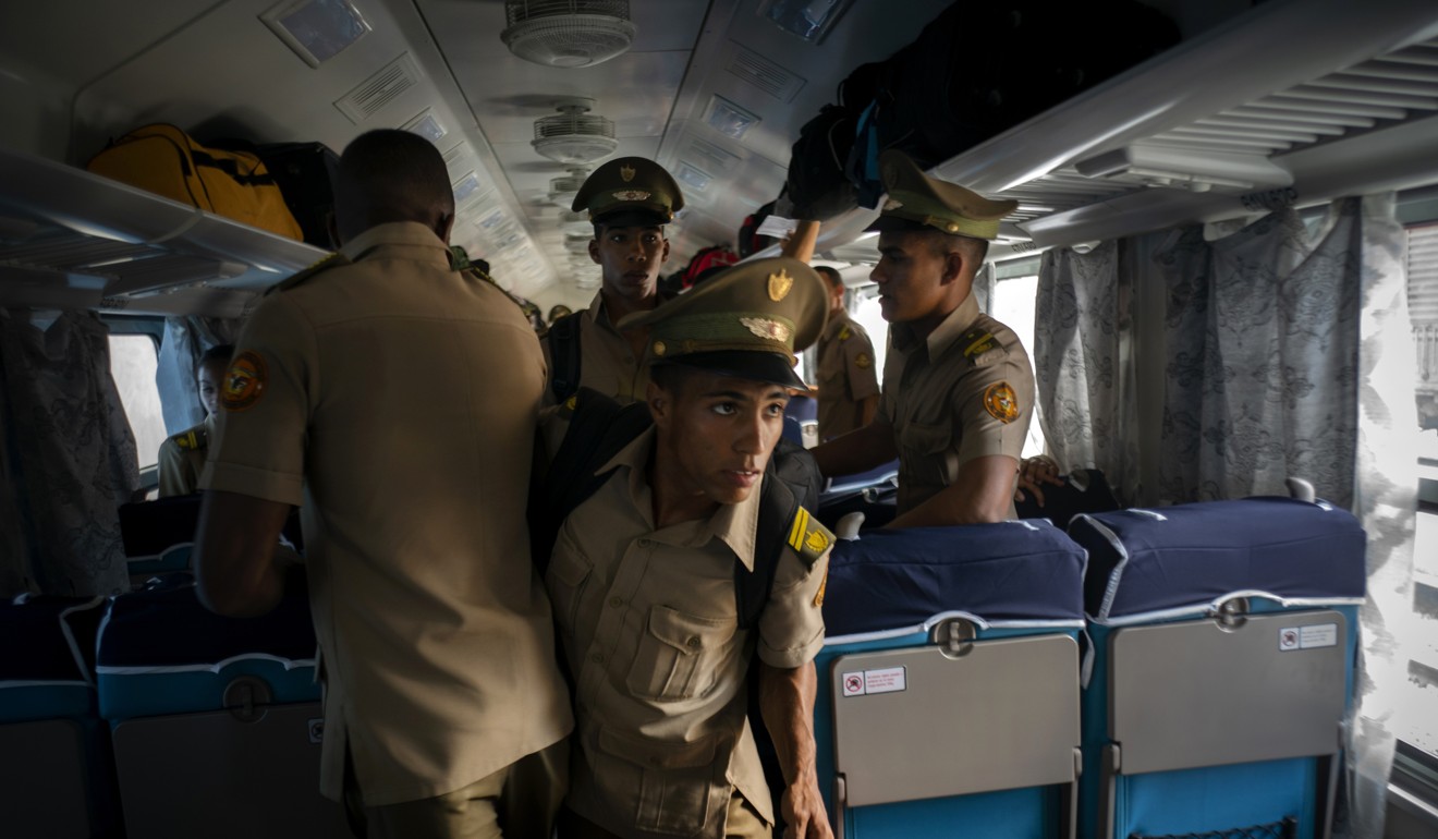 Cadets board the first train using new equipment from China. Photo: AP