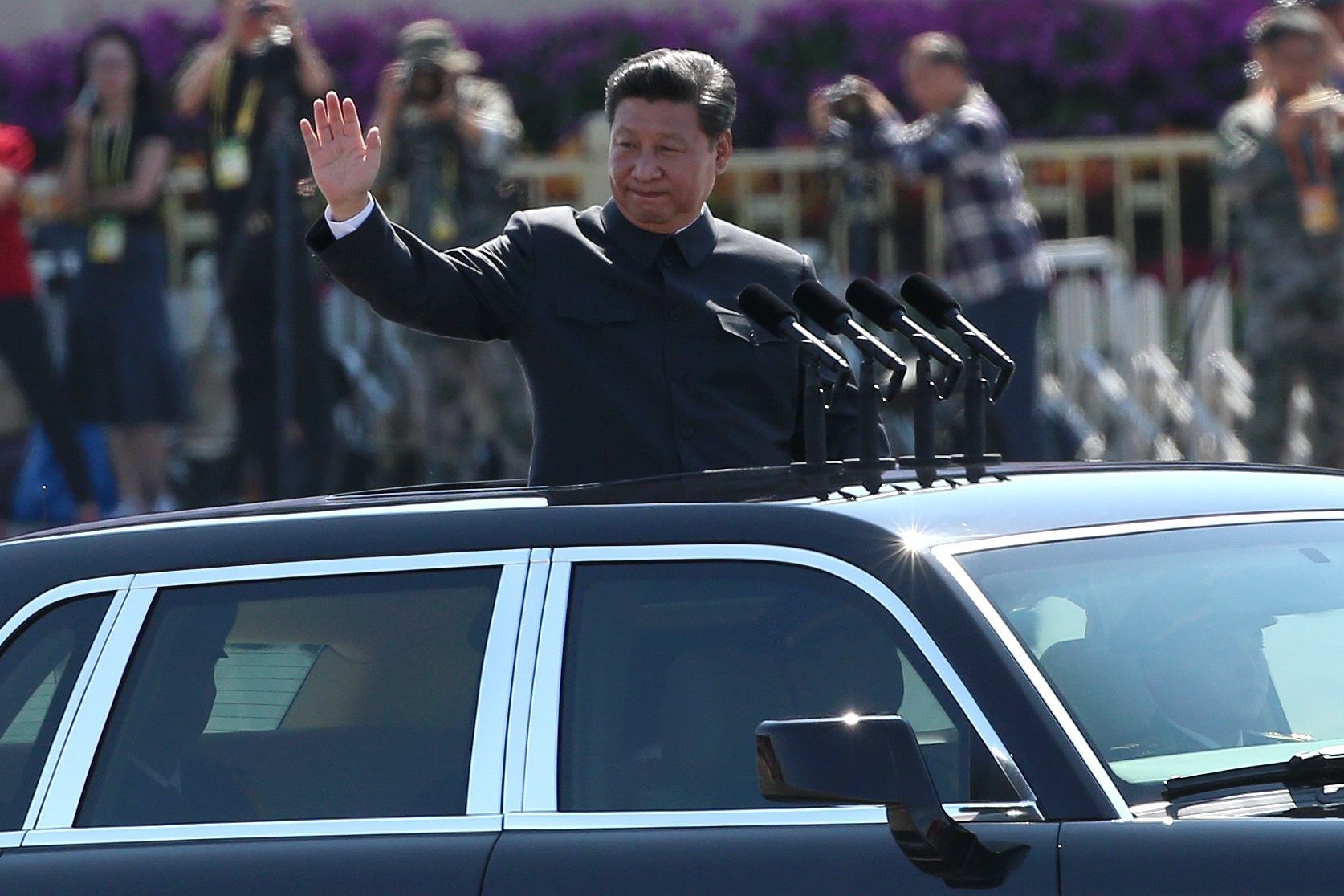 President Xi Jinping waves as he reviews troops on Tiananmen Square during a Victory Day military parade in September 2015. He has signed two amnesty orders since taking office, one to mark the 70th anniversary of the end of the second world war in 2015, and the other to celebrate the 70th anniversary of the founding of the People’s Republic China this year. Photo: EPA