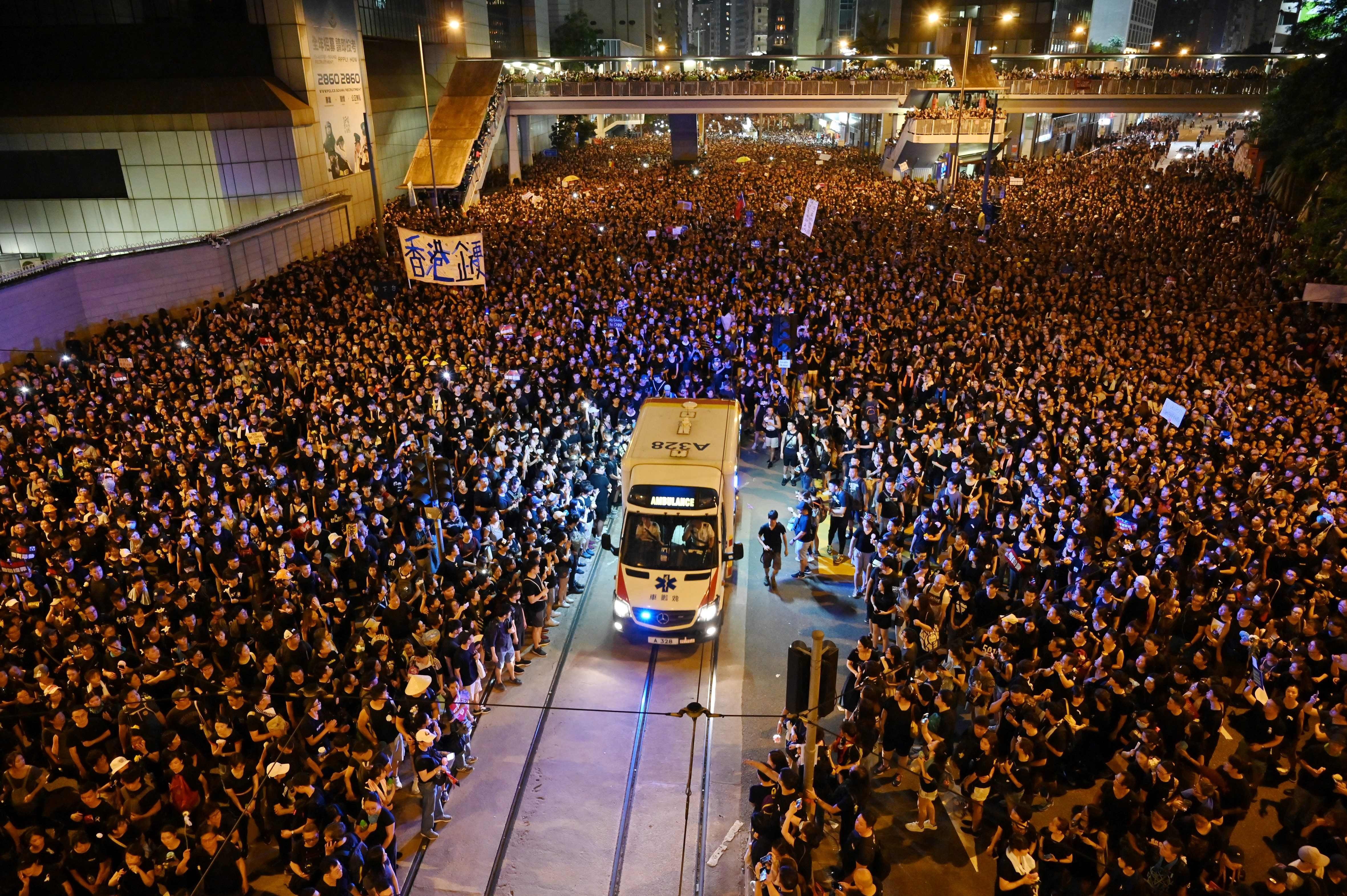 Crowds part to allow an ambulance through during a rally on June 16 against the Hong Kong government’s proposal to amend the city’s extradition laws that would allow the transfer of fugitives to mainland China. Photo: AFP