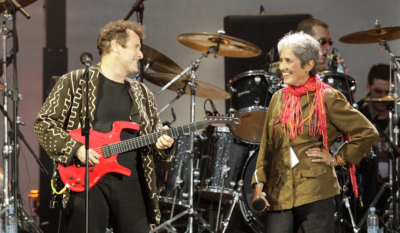 Clegg performing with US singer Joan Baez in Hyde Park, London. Photo: AFP
