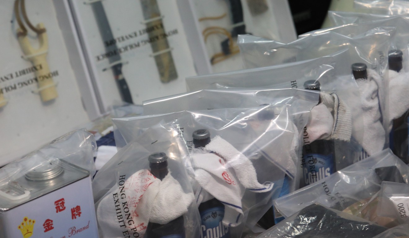 Petrol bombs, knives and rods were among items seized. Photo: Felix Wong