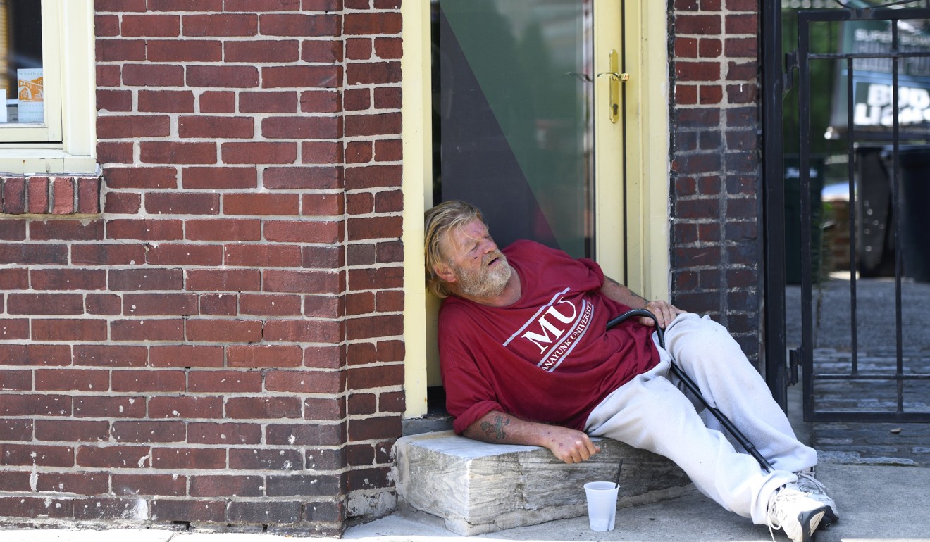 A man sleeps in the shade on a street in Philadelphia. Photo: AFP