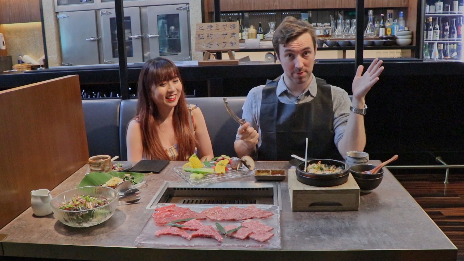 Avowed vegan Lim Li Ying (left) and her meat-eating colleague Douglas Parkes have a meal at the meat grill Yakiniku Jumbo in Central, Hong Kong.