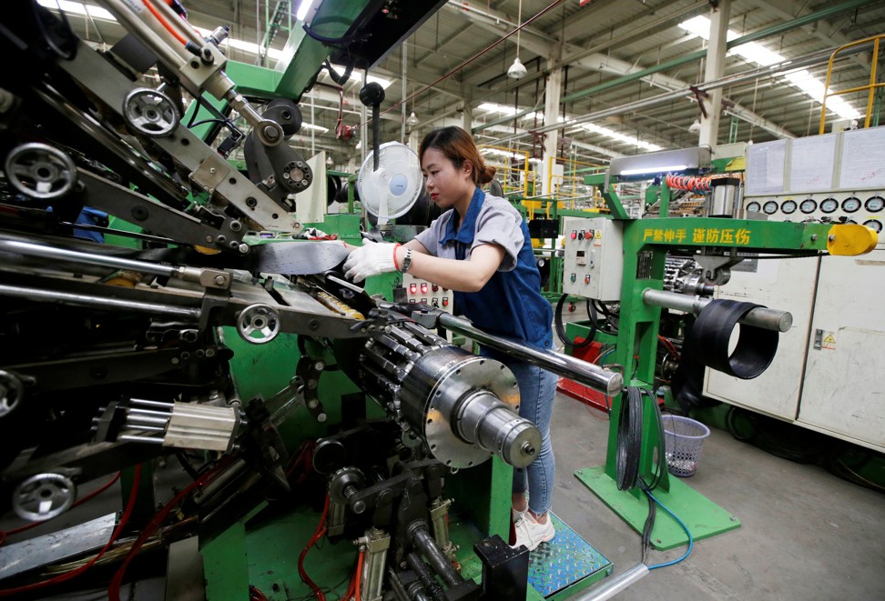 An employee works on the production line of a tyre factory under Tianjin Wanda Tyre Group, which exports its products to countries such as US and Japan, in Xingtai, Hebei province. Photo: Reuters