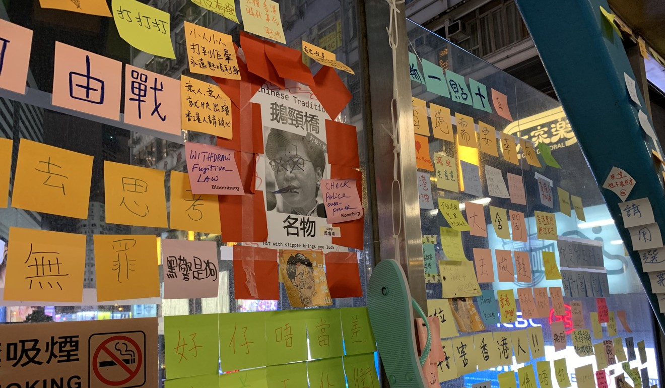 Carrie Lam’s picture posted next to a hanging flip-flop, allowing passers-by to ‘hit’ her, a practice derived from the Hong Kong tradition of ‘villain hitting’. Photo: Zoe Low