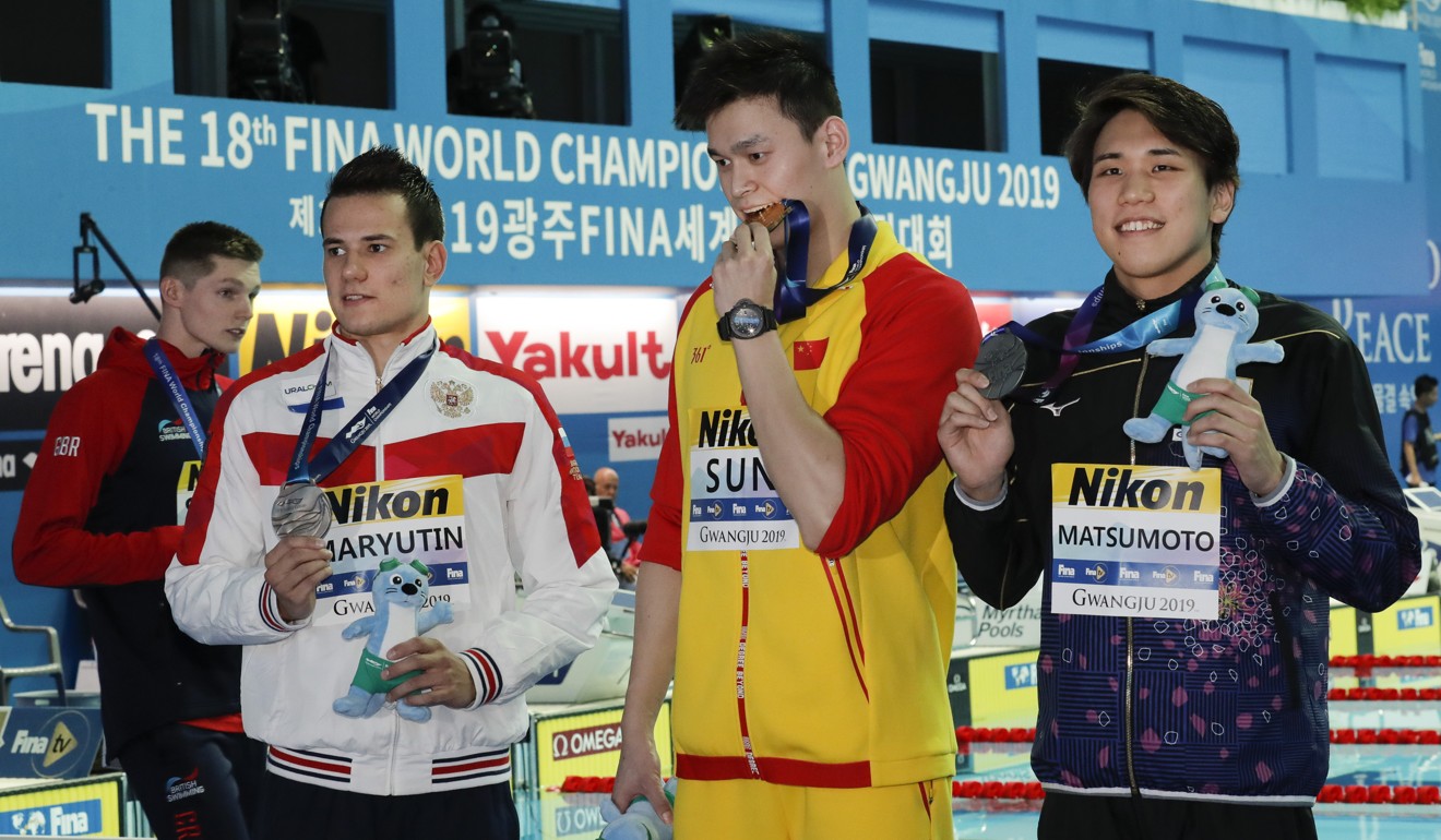 Britain's bronze medallist Duncan Scott refuses to join gold medallist Sun Yang on the podium. Photo: AP