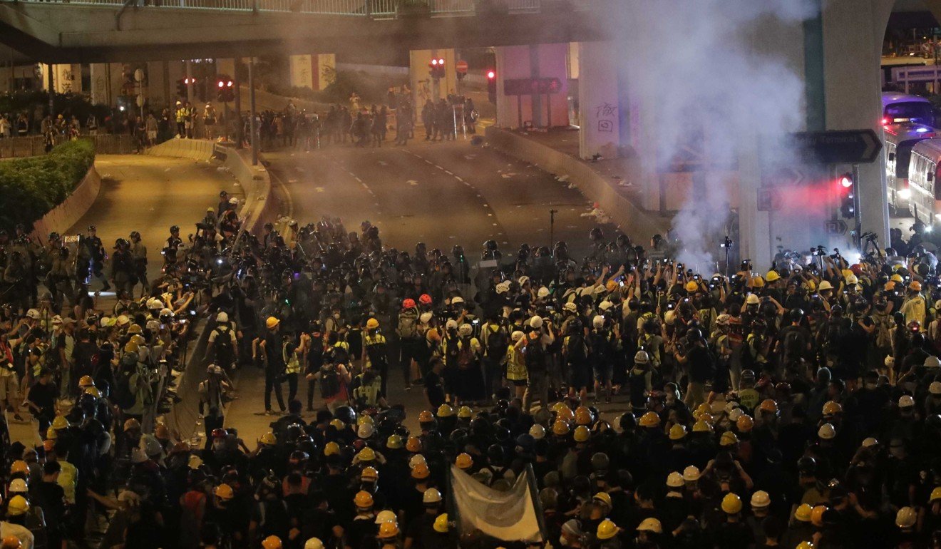 Police fire tear gas for the first time at around 10pm. Photo: Edmond So