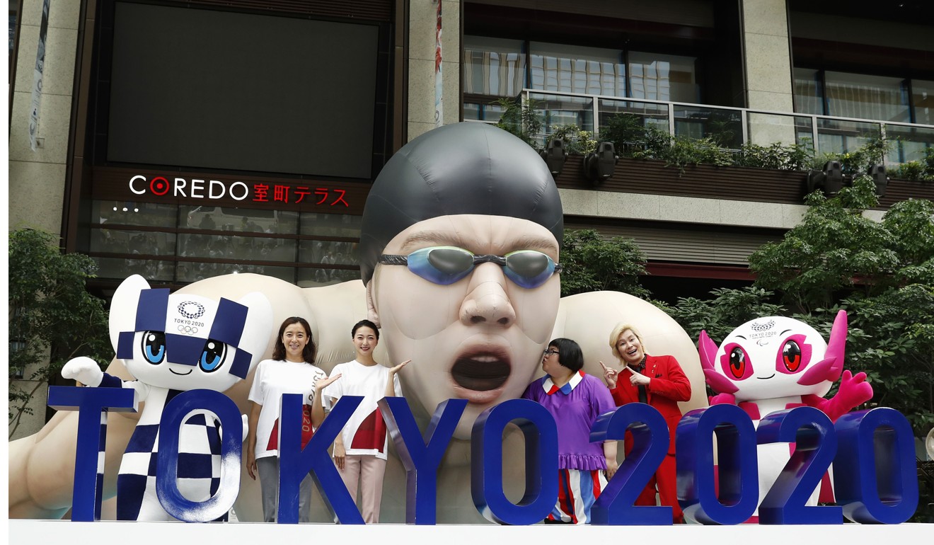 A sculpture of an athlete is unveiled in Tokyo’s Nihombashi district marking of the one-year countdown to the Tokyo Olympics opening ceremony. Photo: Kyodo
