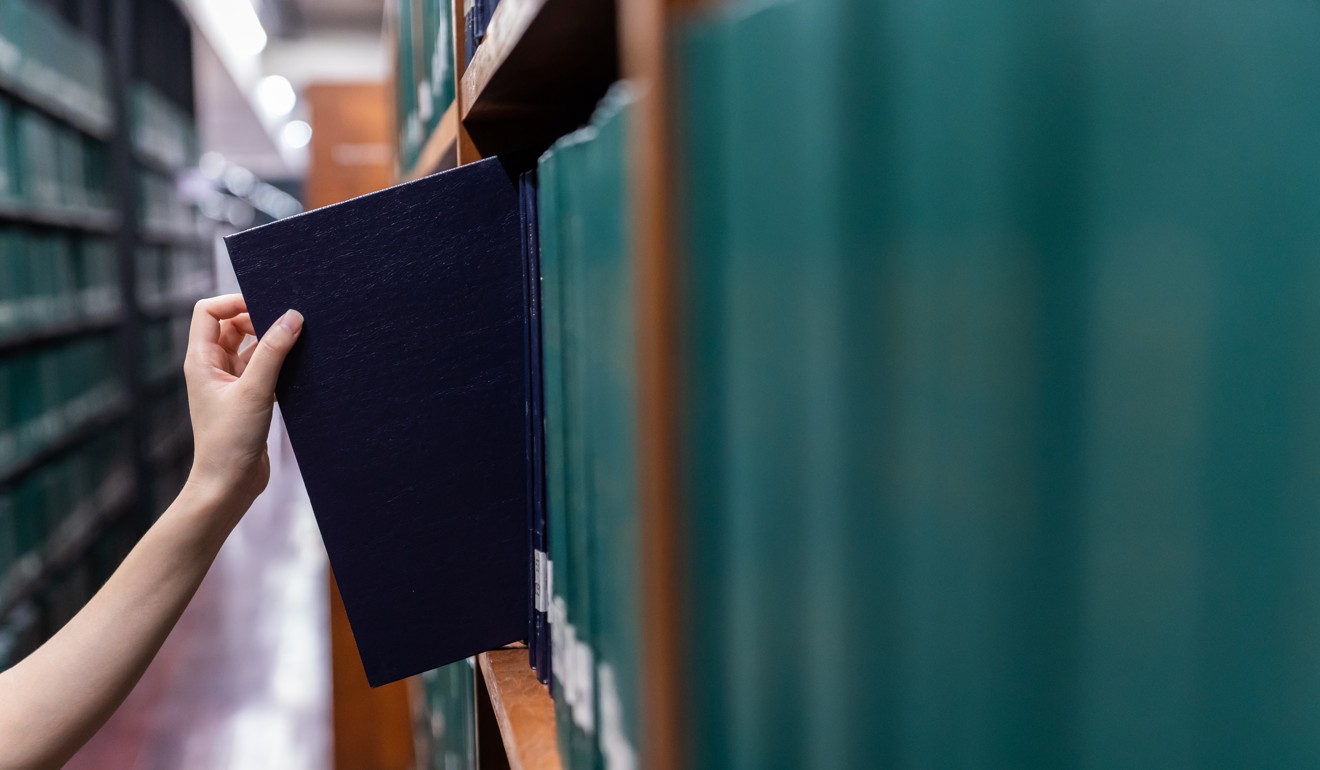 The number of Australian peer-reviewed papers with a Chinese co-author has shot up in the past 20 years. Green colors books. Photo: Shutterstock