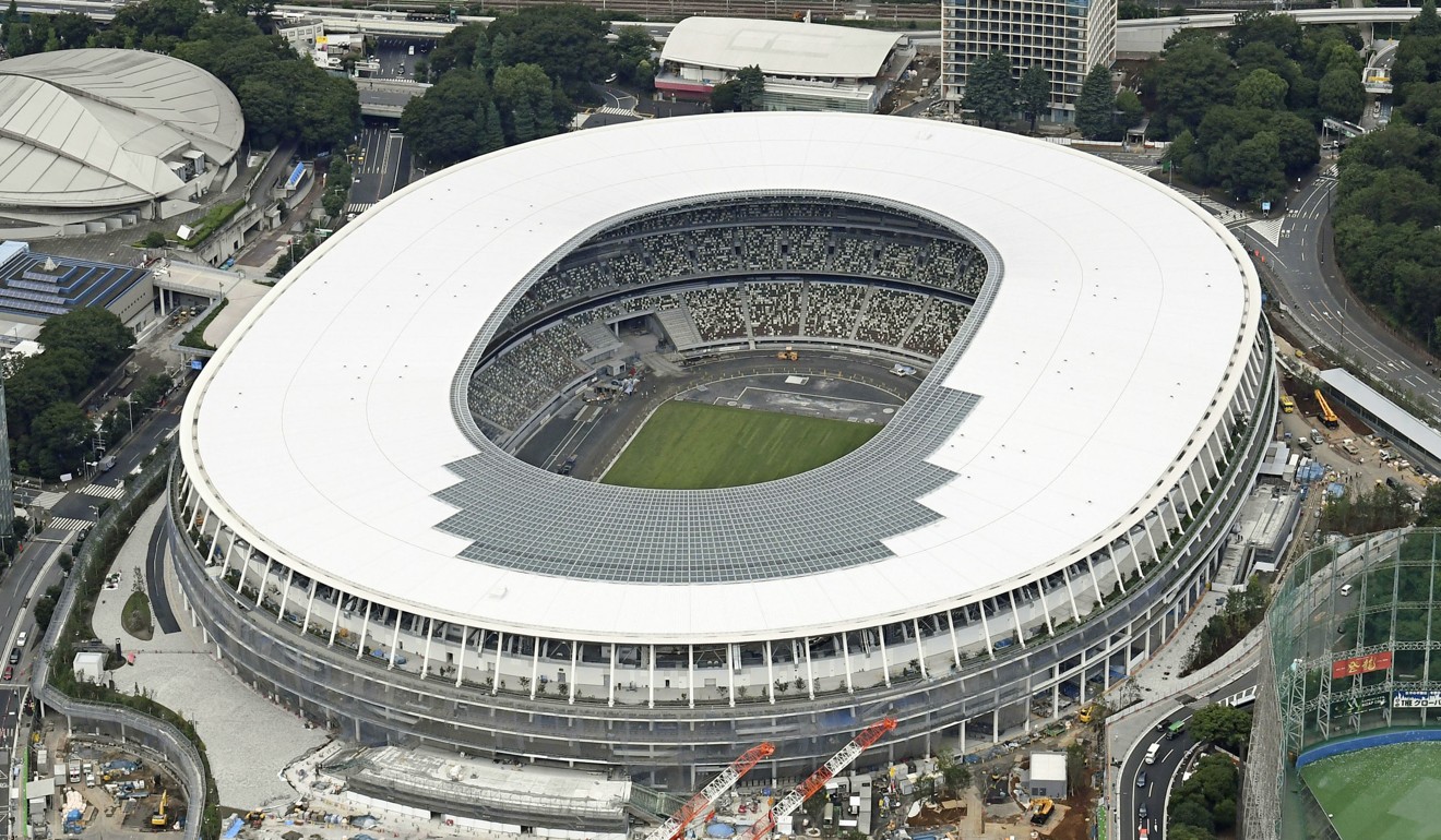 Japan’s new National Stadium in Tokyo, the main venue for the 2020 Olympics and Paralympics, still under construction one year ahead of the Games. Photo: Kyodo