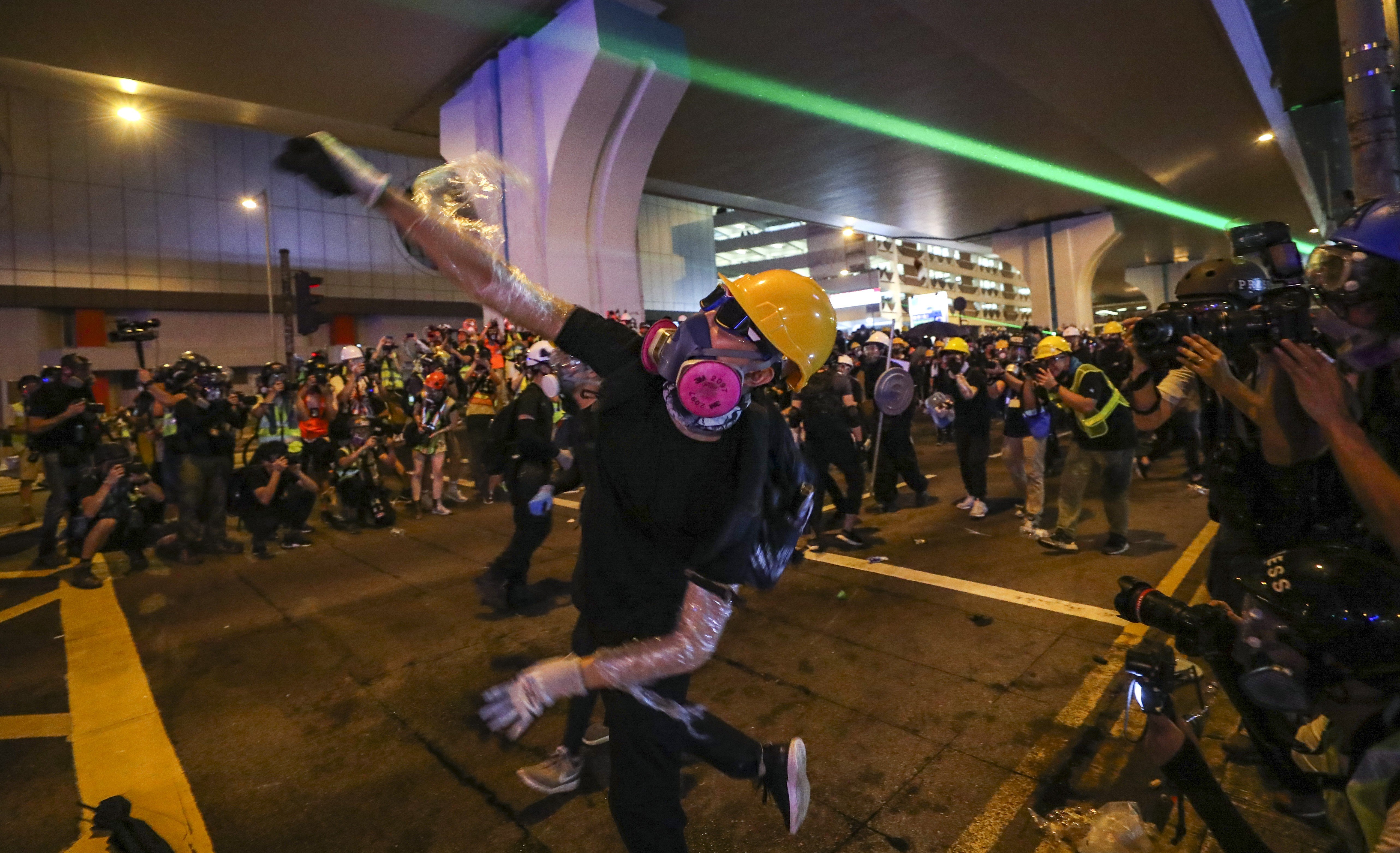 Protesters clash with riot police as they retreat to Connaught Road in Central after rallying outside the central government’s liaison office in Sai Ying Pun. Photo: Sam Tsang