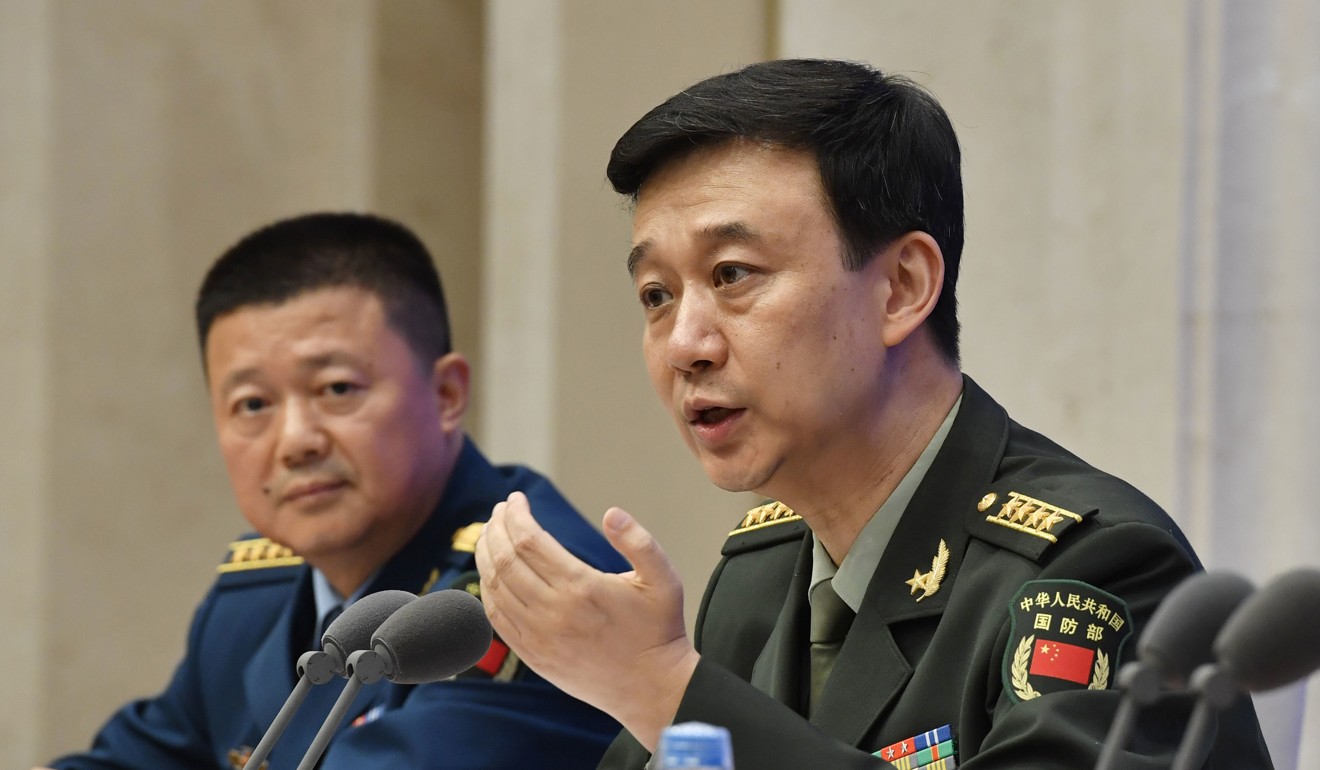 Chinese National Defence Ministry spokesman Wu Qian (right) at a news briefing in Beijing on Wednesday after China released its defence white paper. Photo: Kyodo