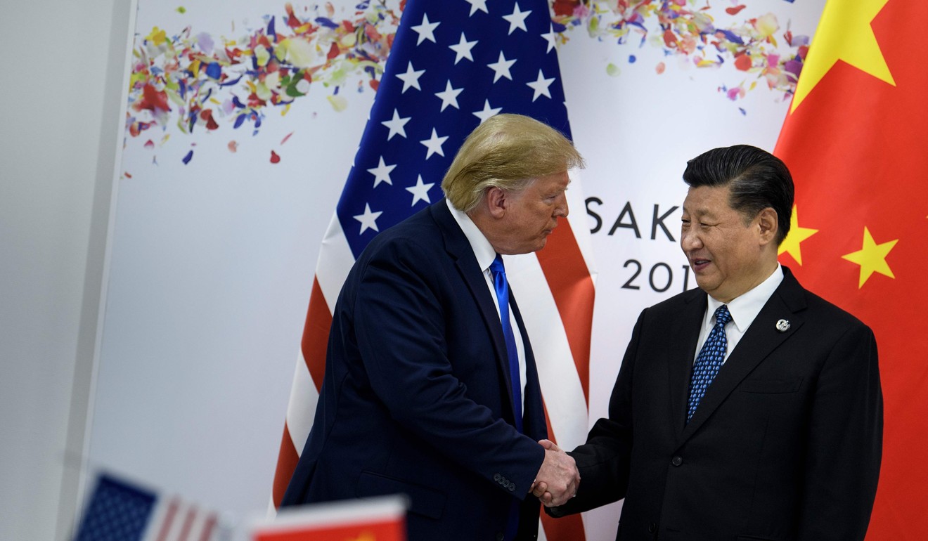 US President Donald Trump (L) and President Xi Jinping shake hands during a bilateral trade talk on the sidelines of G20 Summit in Osaka on June 28. Photo: AFP