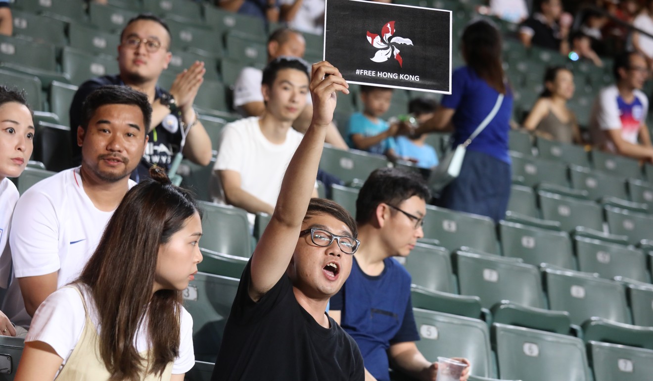 Protesters chanted and held up signs at Hong Kong Stadium. Photo: K.Y. Cheng