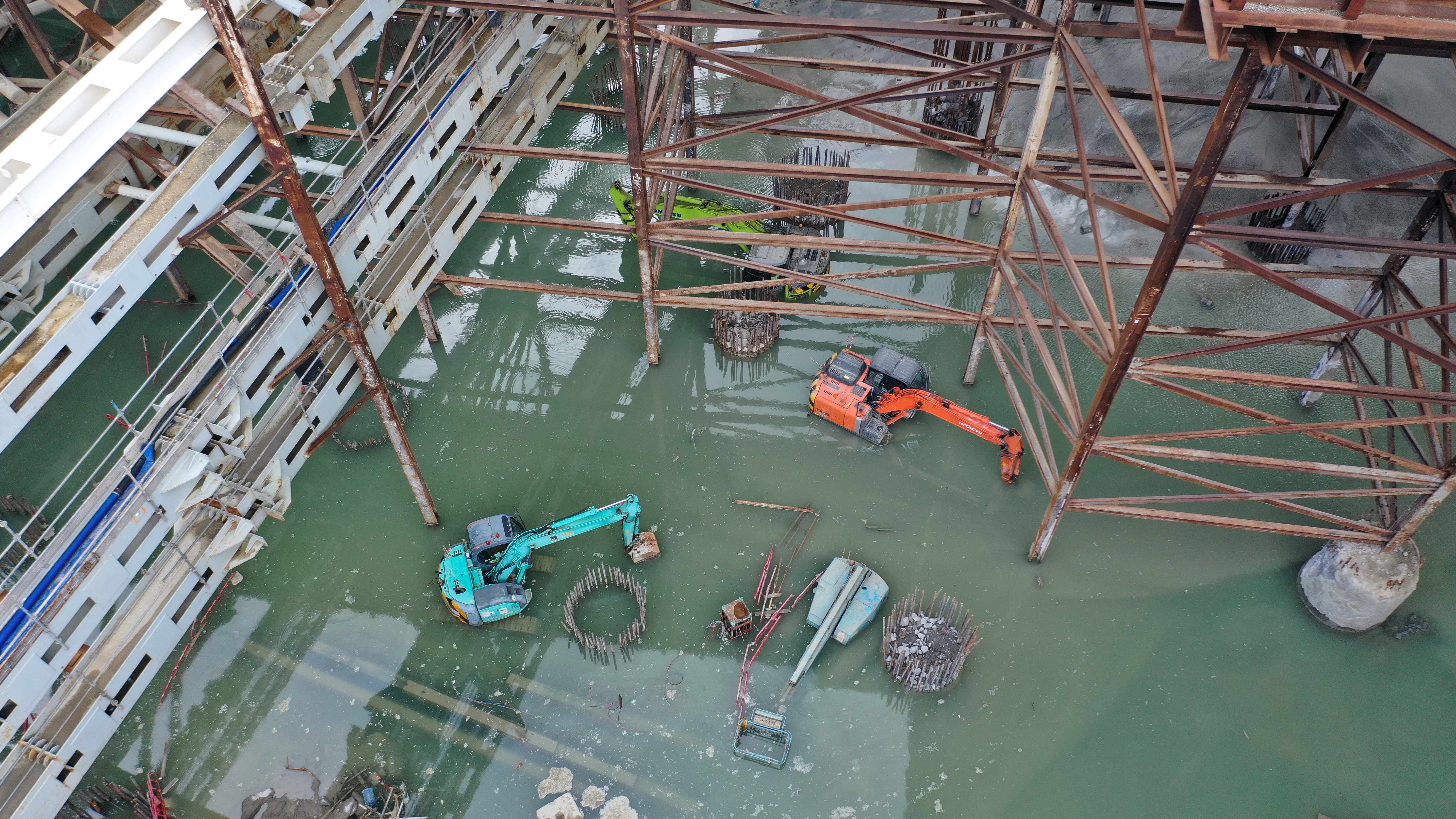 Construction equipment is submerged by flooding on Thursday at the building site of the West Kowloon Cultural District. Photo: Winson Wong
