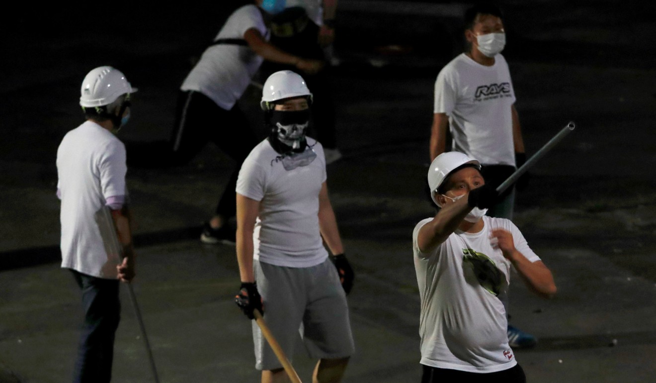 Men in white T-shirts in Yuen Long attacked extradition bill demonstrators and commuters at Yuen Long station on July 21. Photo: Reuters