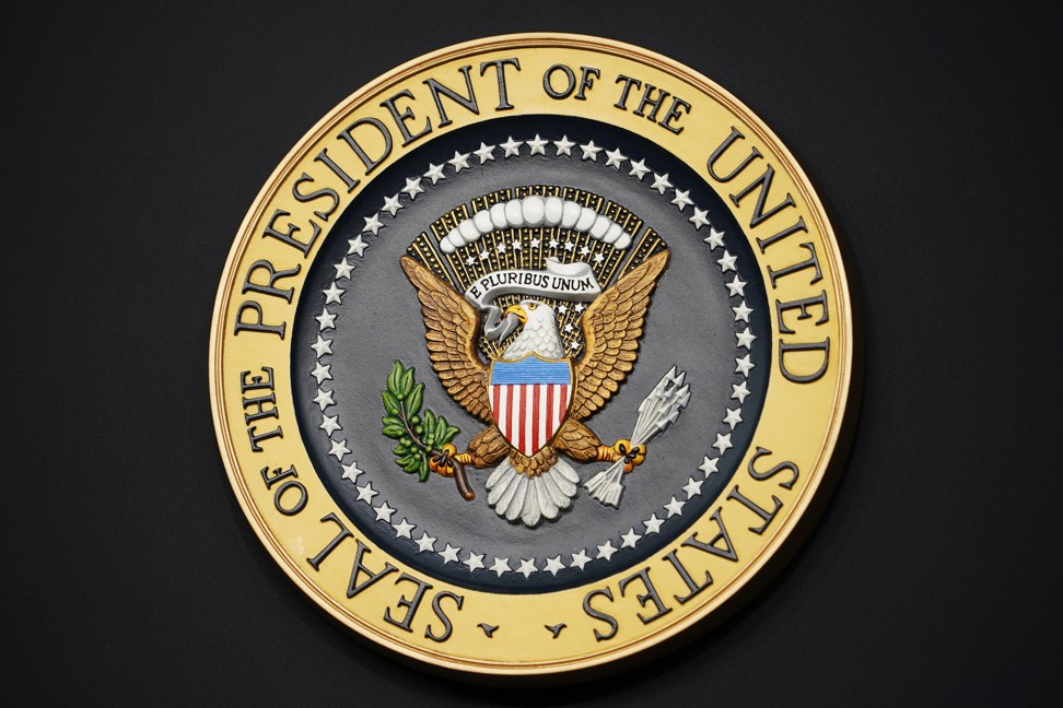 The real presidential seal, minus the golf clubs. Photo: AFP