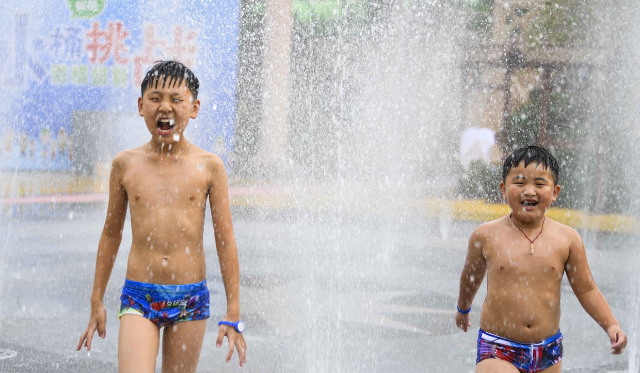 Children try to keep cool at a park in Bozhou, Anhui Province, in early July. Photo: Xinhua