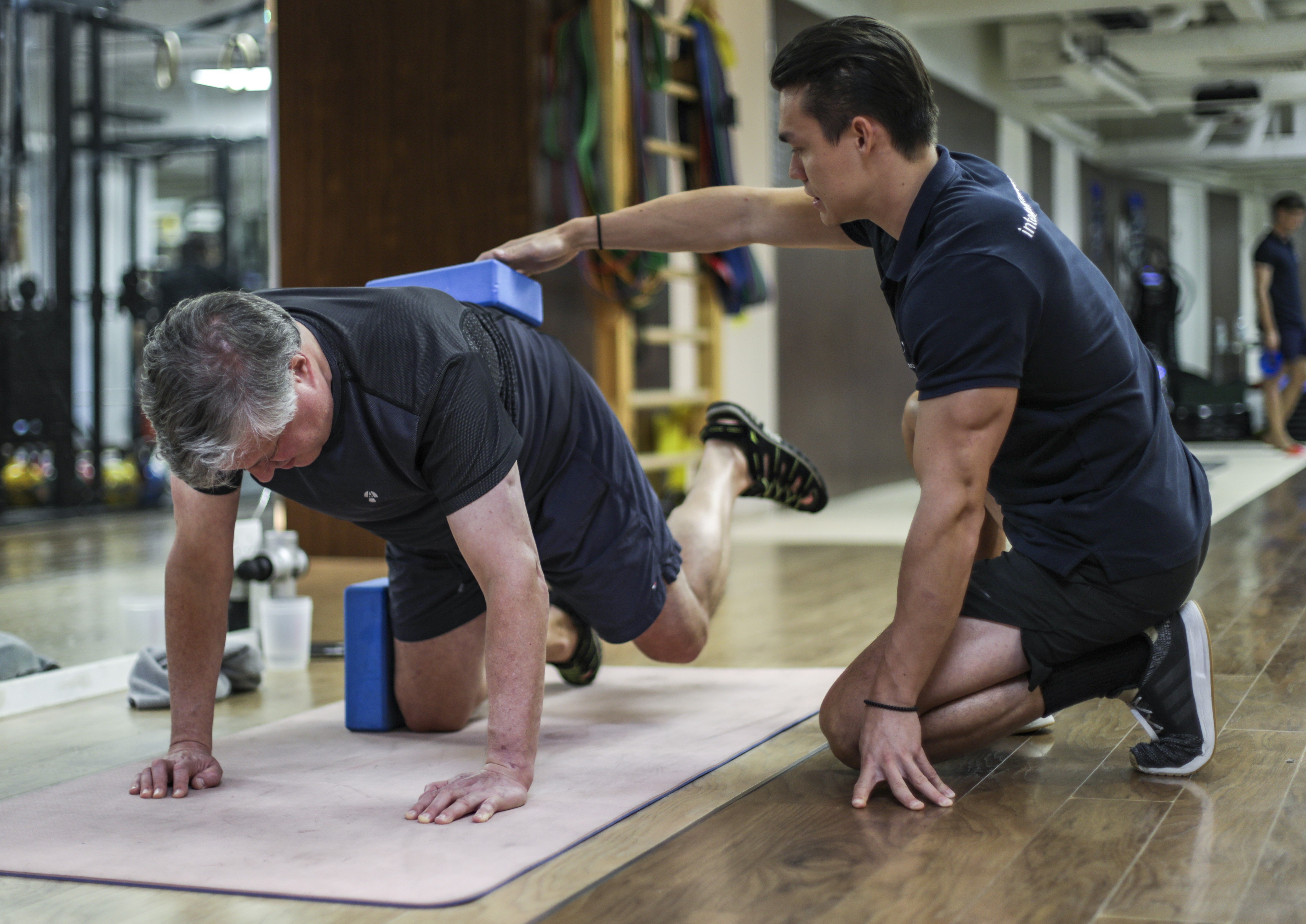 Exercises to help prevent falls: exercise physiologist Geoffrey Bland (right) leading his client Nick Colfer, 59, through a series of exercises at Joint Dynamics in Hong Kong’s Central district. Photo: Tory Ho