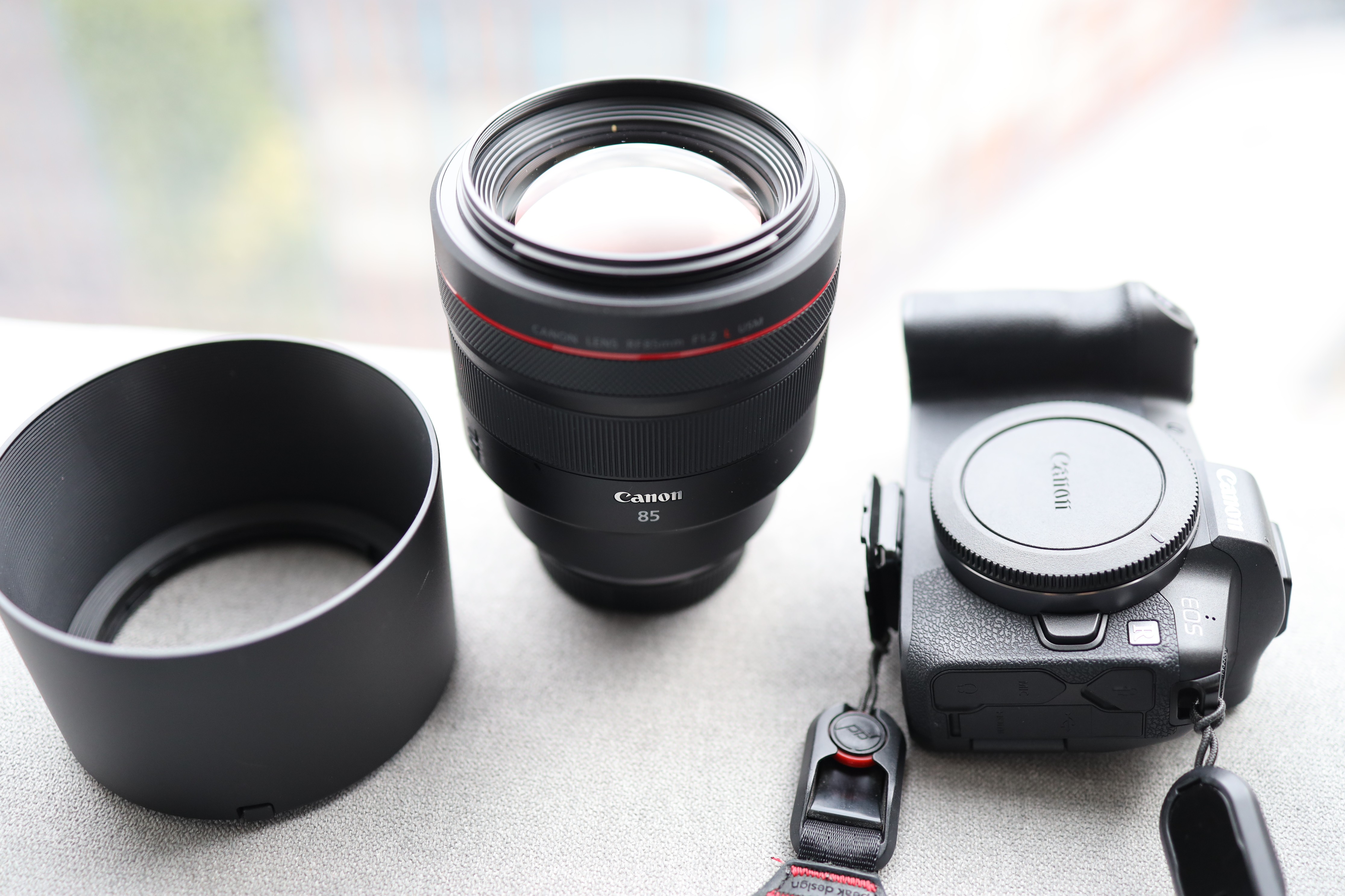 The heavyweight Canon RF 85mm F1.2 USM lens is a great addition to your camera equipment – but be prepared for some aches and pains from carrying it around. Photo: Derek Ting