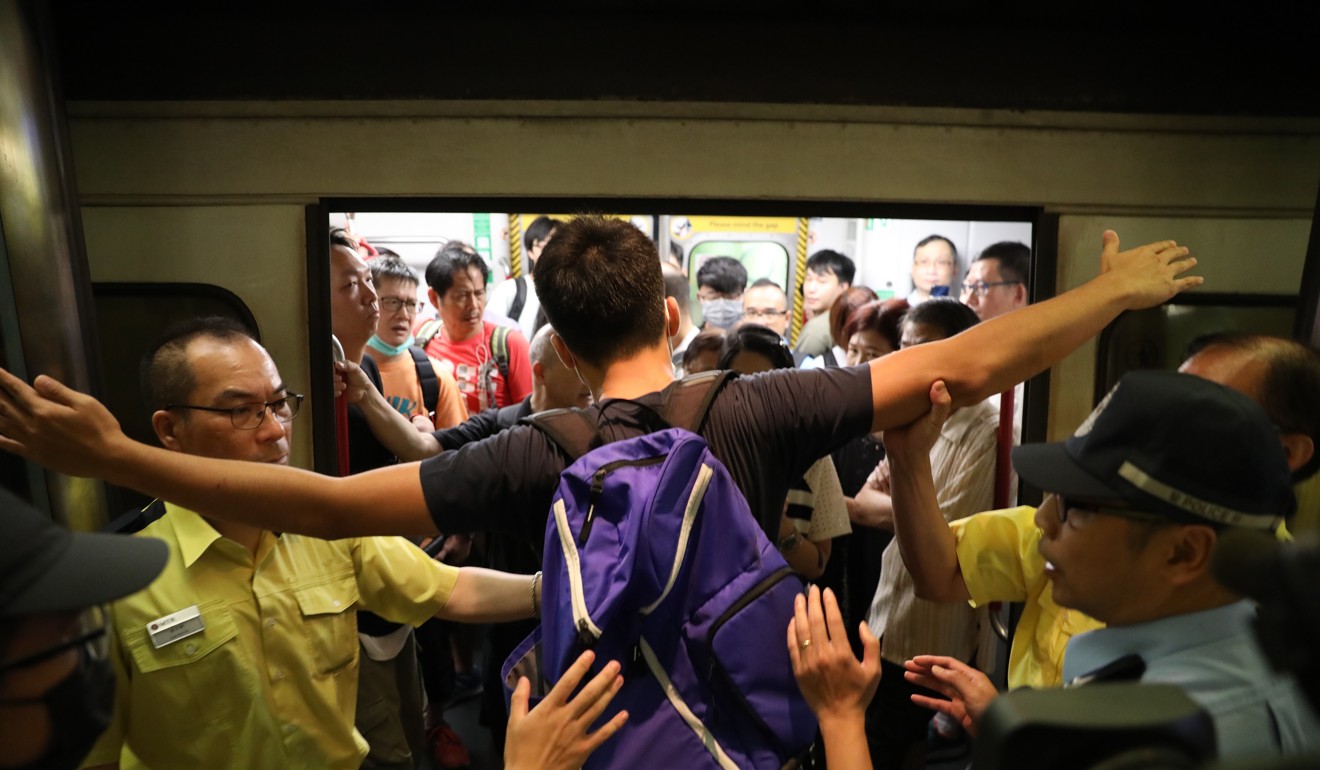 Protesters prevent trains from leaving Tiu Keng Leng station on Tuesday morning. Photo: Nora Tam