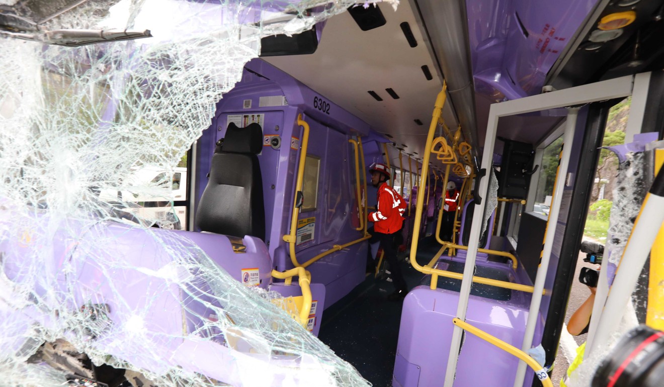 One of the bus’ windscreens is smashed in. Photo: Felix Wong
