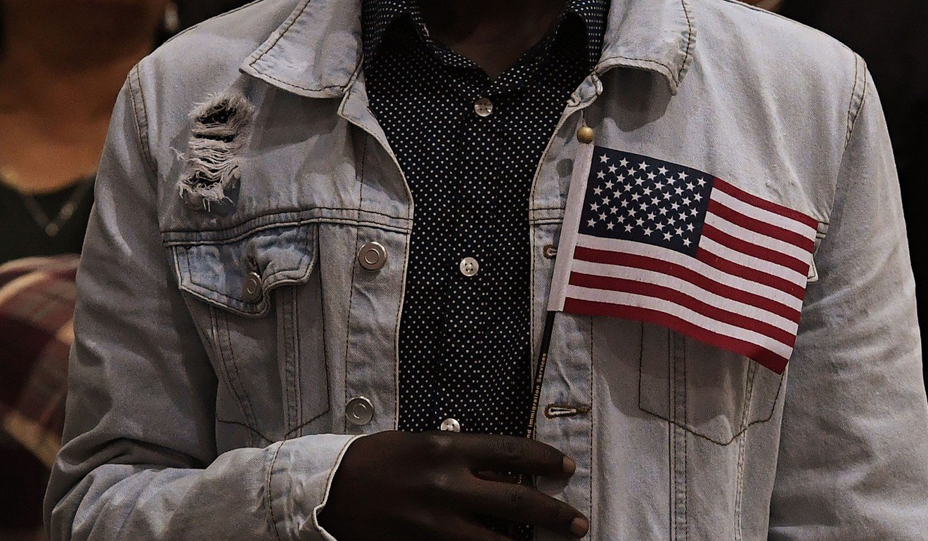A new citizen pledging allegiance to the United States at a naturalisation ceremony in Los Angeles. Photo: AFP