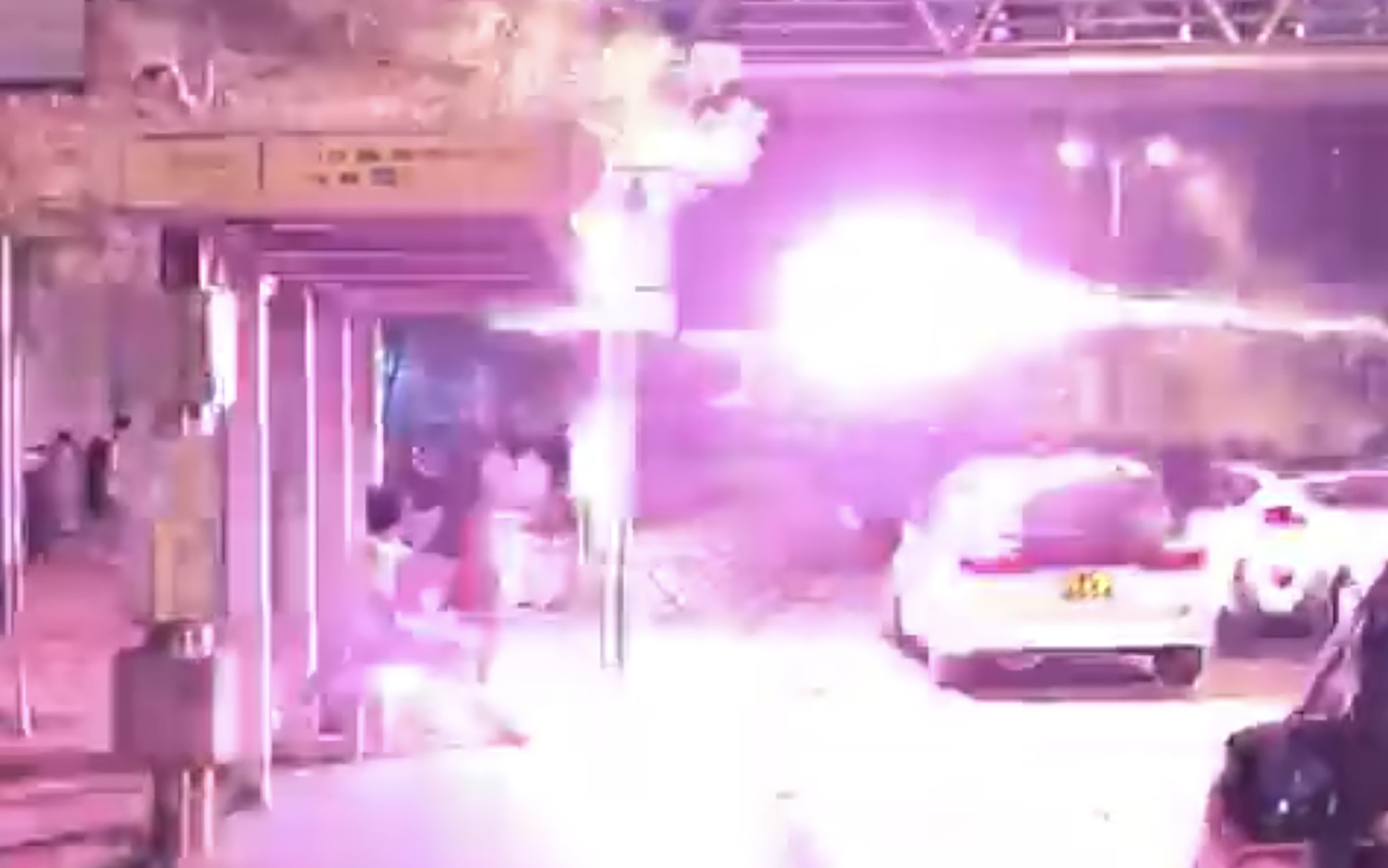Fireworks were shot from a car at protesters outside Tin Shui Wai Police Station, seen in this video screen grab. Photo: SCMP Pictures