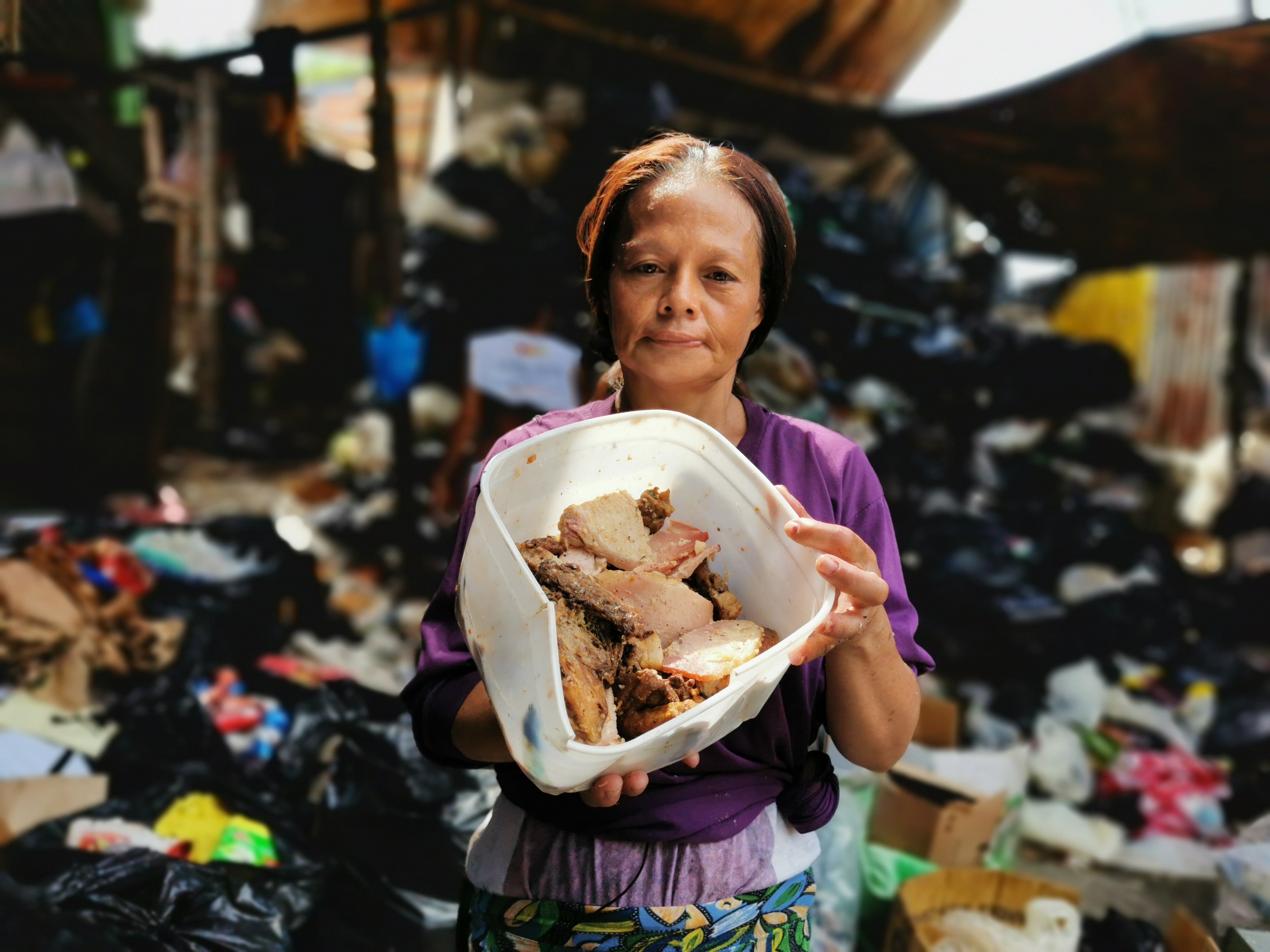 Myrna Salazar collects pagpag at Joe’s Junk Shop in Payatas. Photo: SCMP Pictures