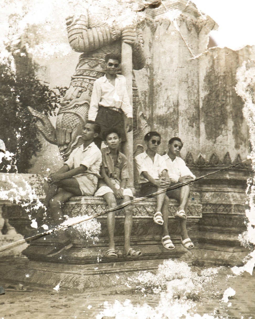 Vira’s father (standing) with his high school friends at Wat Piphittearam in Battambang. Photo: Charles Fox